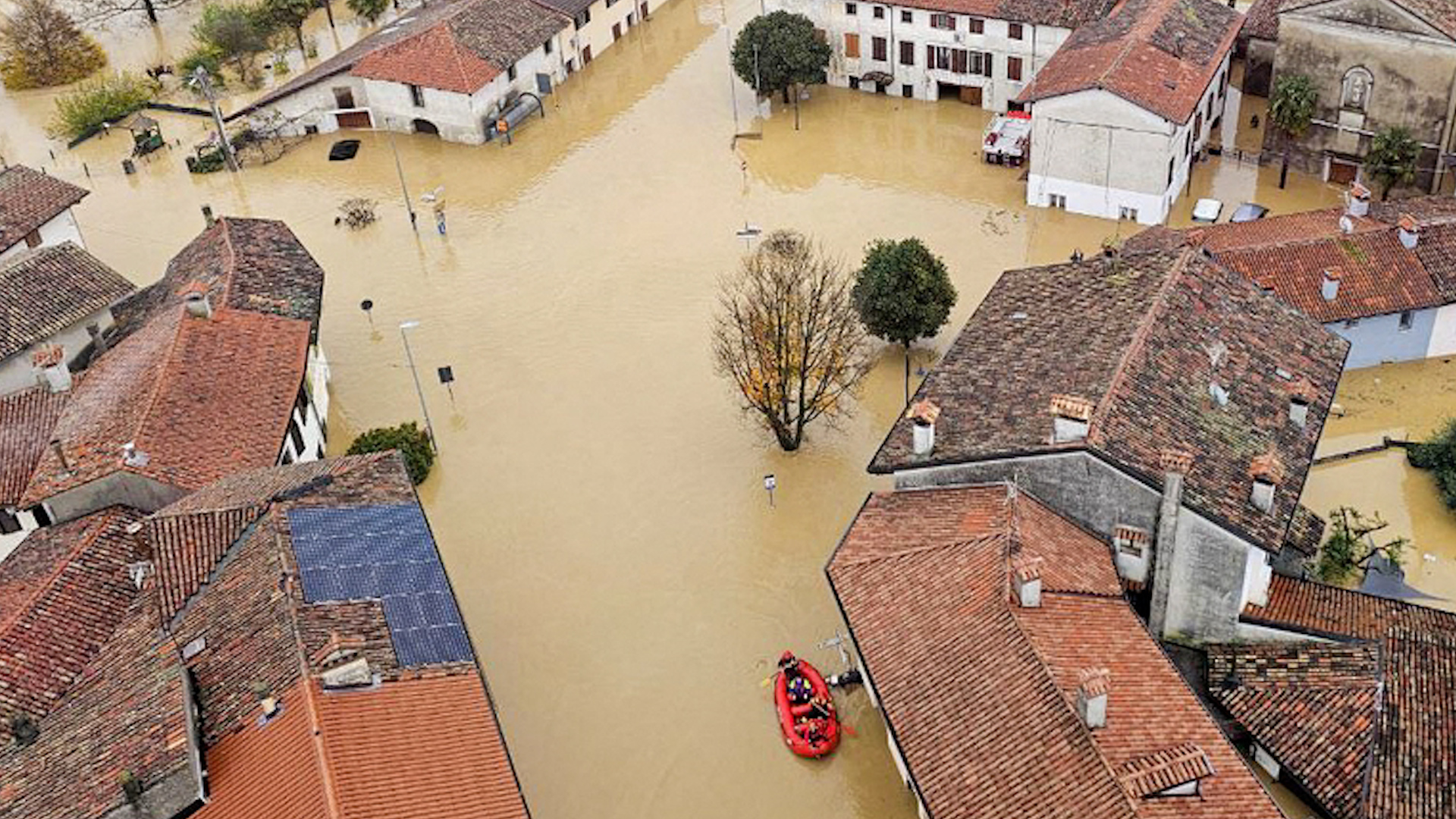 This photograph taken and released on Nov. 17, 2025 by the Vigili del Fuoco, the Italian corps of Firefighters, shows aerial view of major flooding near Udine in the area of Friuli Venezia Giulia, in Northern Italy after heavy rainfall. Firefighters have carried out dozens of operations so far to help drivers in distress, people trapped in their homes by water, floods, and landslides. [Vigili del Fuoco/AFP]