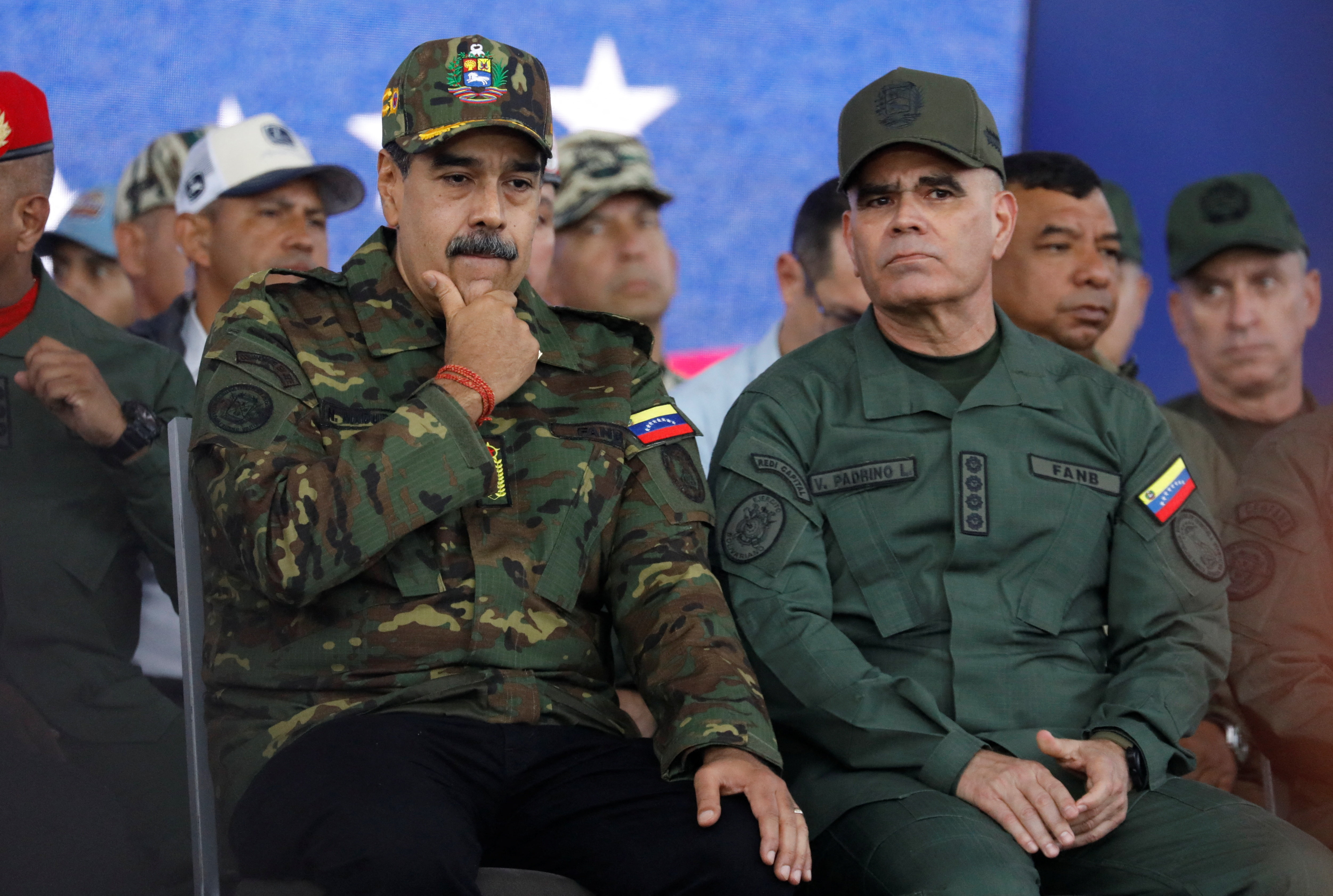 Venezuela's President Nicolas Maduro sits with Defence Minister Vladimir Padrino Lopez