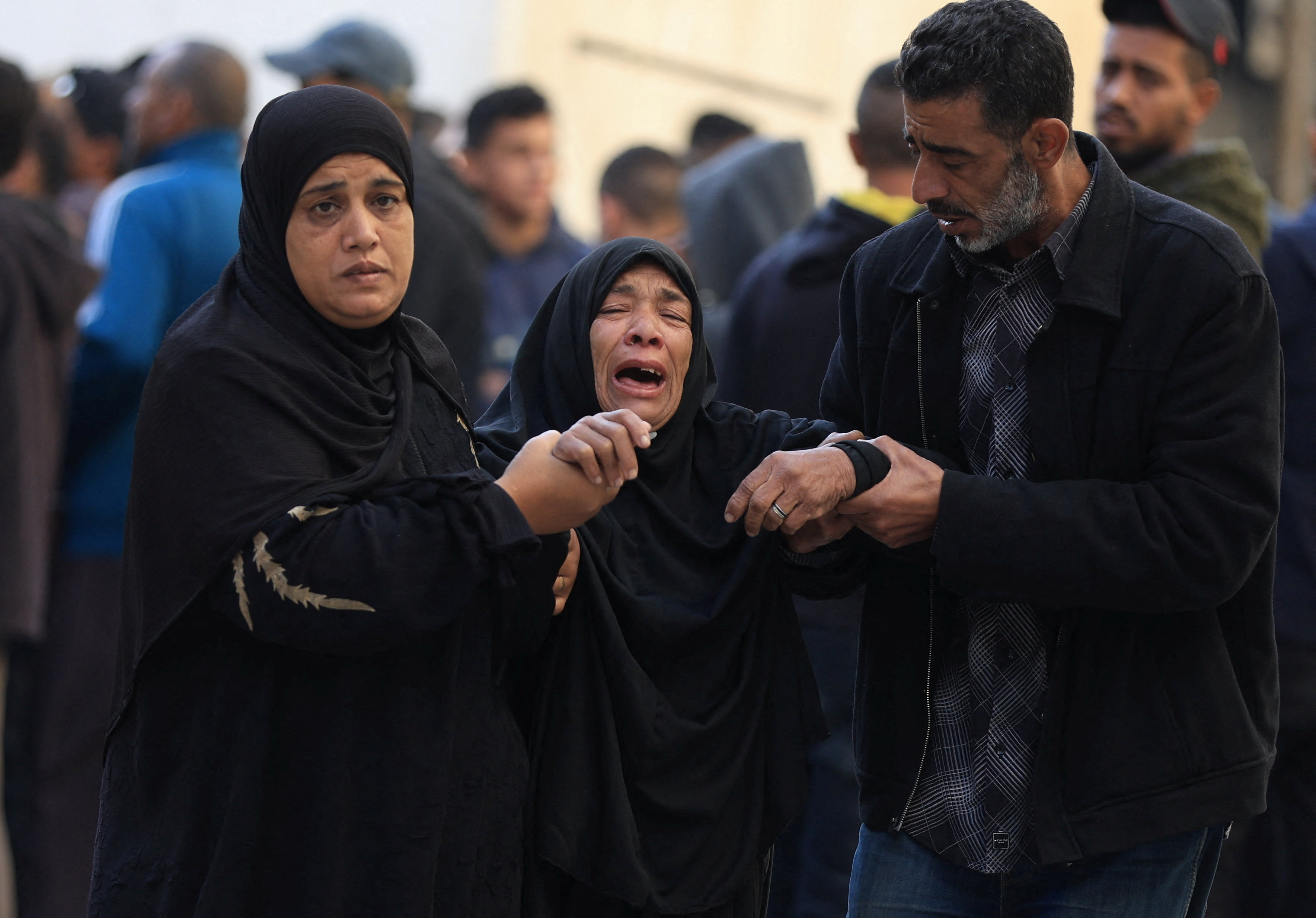 Mourners react as they attend the funeral of Palestinians who, according to medics, were killed in an Israeli strike on Tuesday, at Al-Ahli Arab Hospital in Gaza City, December 3, 2025. [Dawoud Abu Alkas/Reuters]