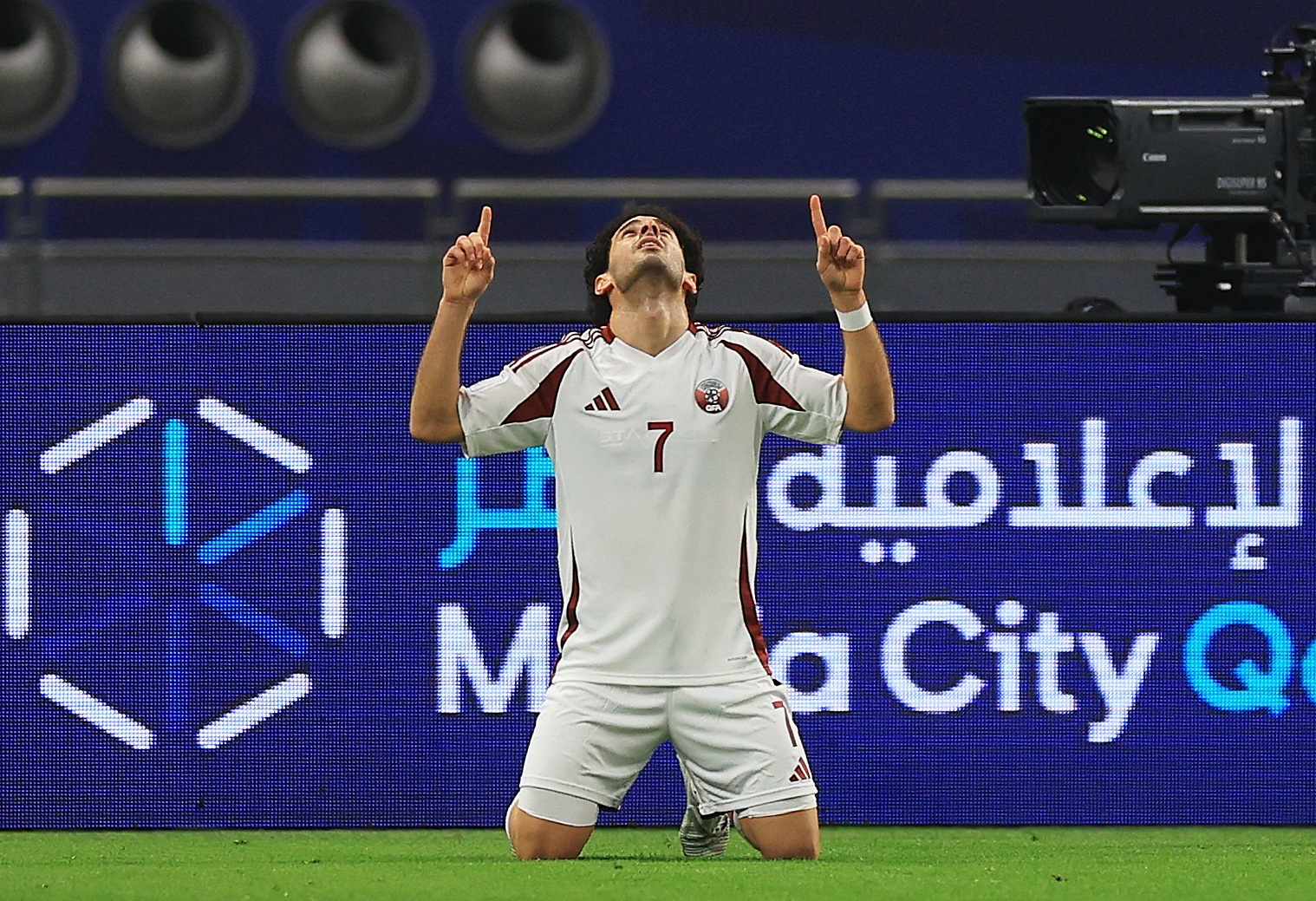 Qatar's Ahmed Alaa celebrates scoring their first goal