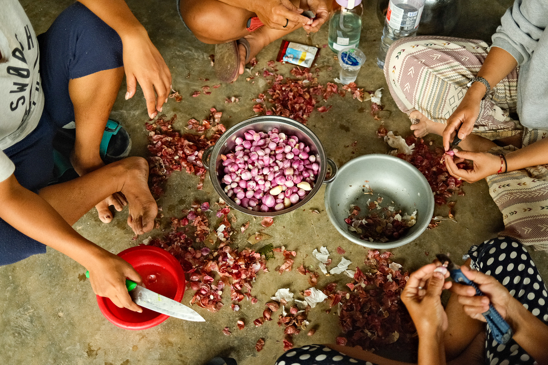 At a church in North Tapanuli, women work together to prepare meals for the evacuees.  