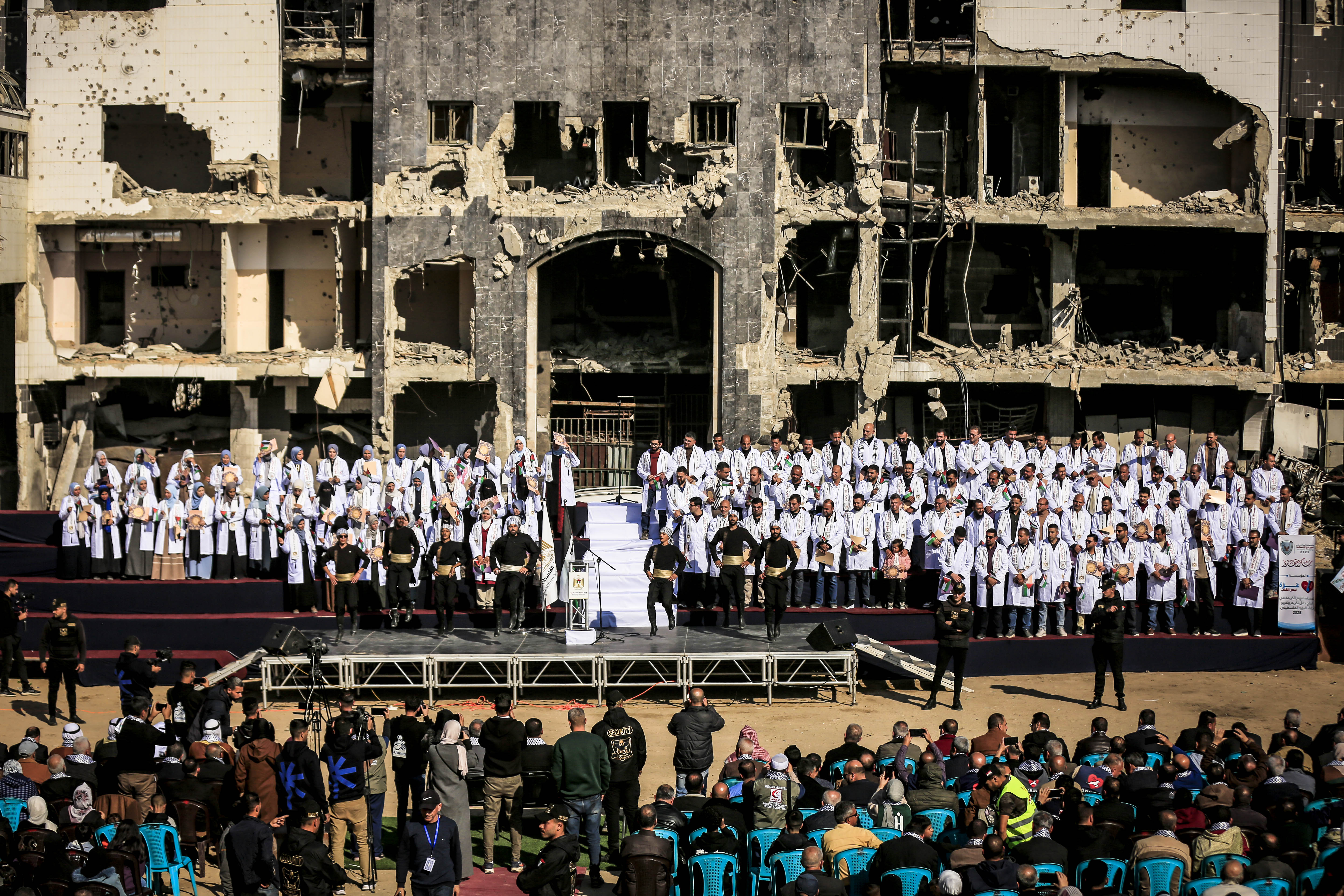 GAZA CITY, GAZA - DECEMBER 25: A view from the graduation ceremony held at Shifa Hospital in Gaza City, which suffered severe damage as a result of Israeli military attacks, for 170 doctors who earned their specialist certificates from the Ministry of Health on December 25, 2025. A large number of Palestinians attended the ceremony, which was held in the hospital garden. ( Saeed M. M. T. Jaras - Anadolu Agency )