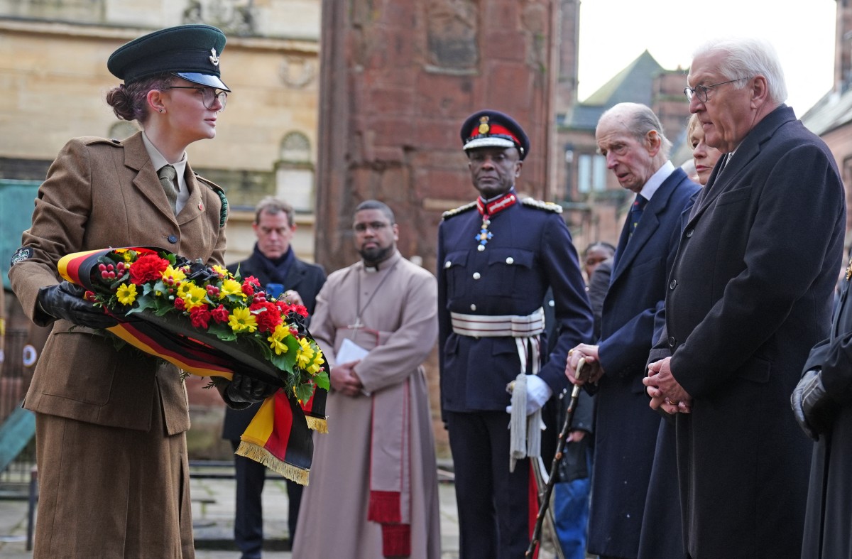 A wreath is laid on behalf of Germany's President Frank-Walter Steinmeier and his wife, during a ceremony in the ruins of the old cathedral.
