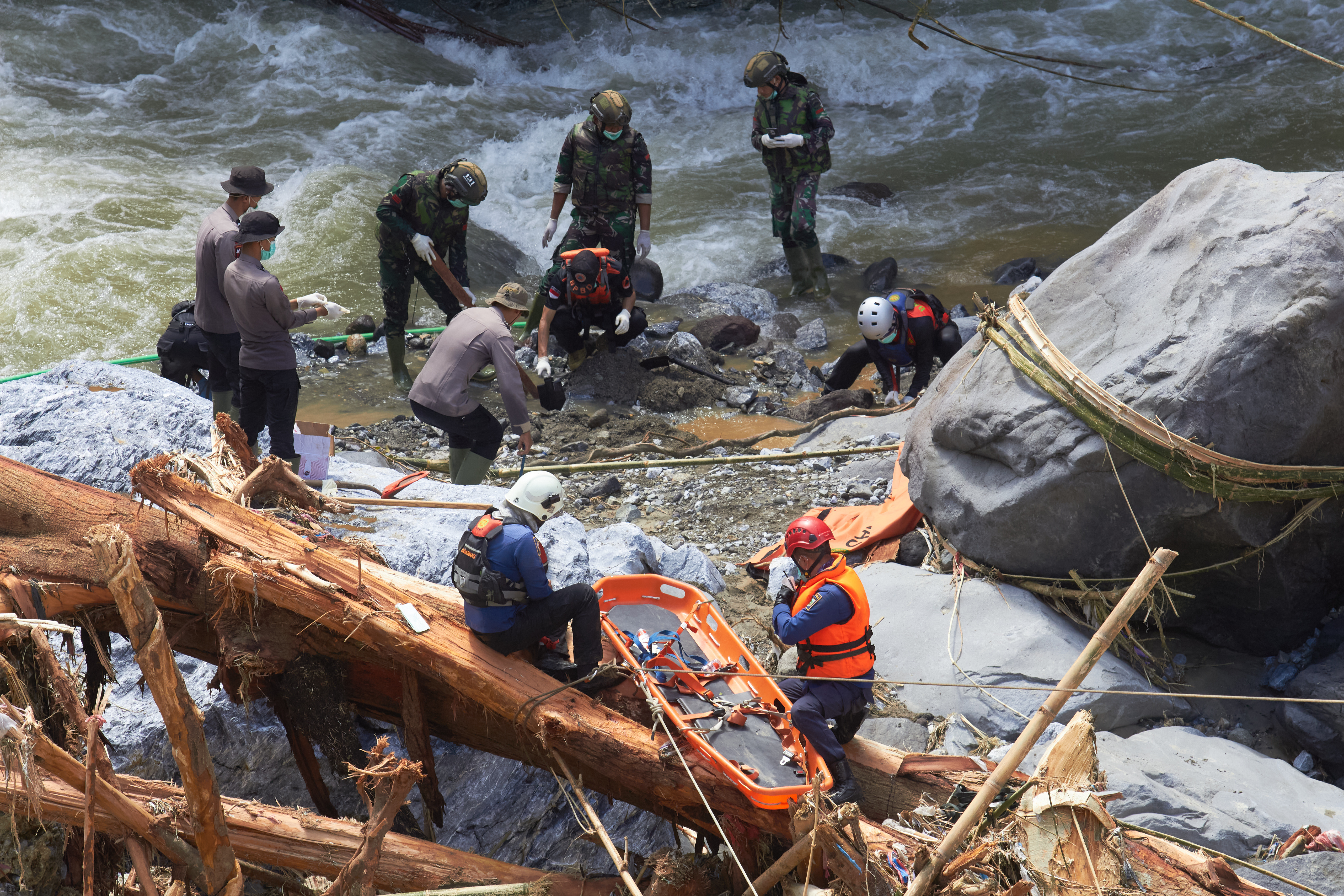 Rescuers search for flood victims in Tanah Datar, West Sumatra, Indonesia, Monday, Dec. 1, 2025.