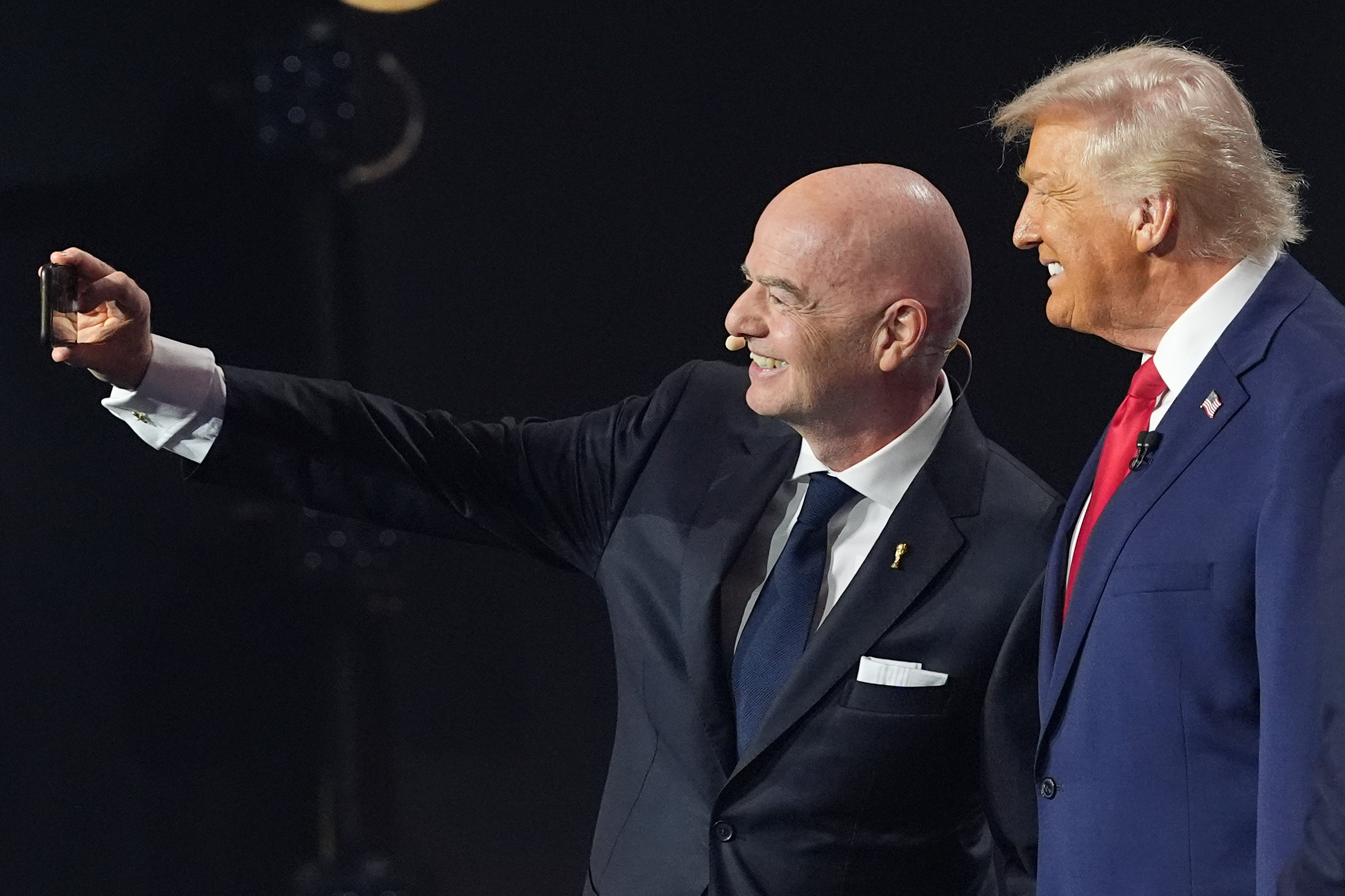 President Donald Trump and FIFA President Gianni Infantino take a selfie during the draw for the FIFA World Cup 2026 at the Kennedy Center in Washington DC [Jacquelyn Martin/AP]