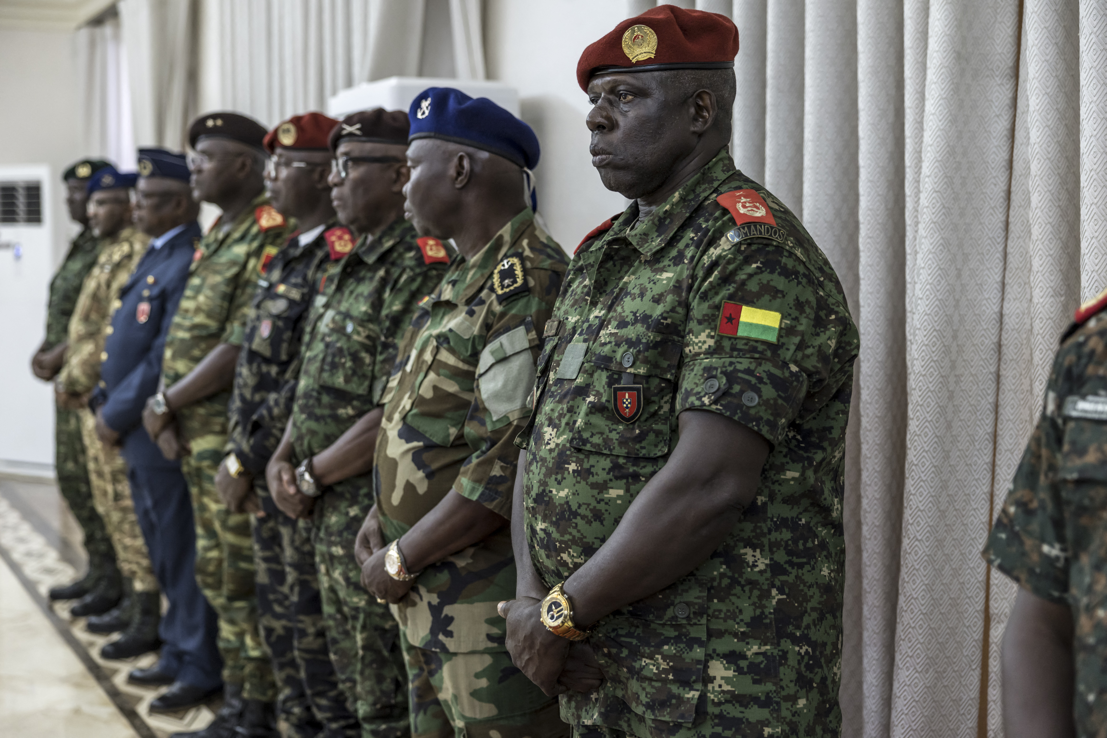 Brigadier General Baute Na Mam (R) stands next to high ranking officers from different branches of the Guinea Bissau army during the swearing-in ceremony of the newly formed government at the Presidential Palace in Bissau on November 29, 2025.