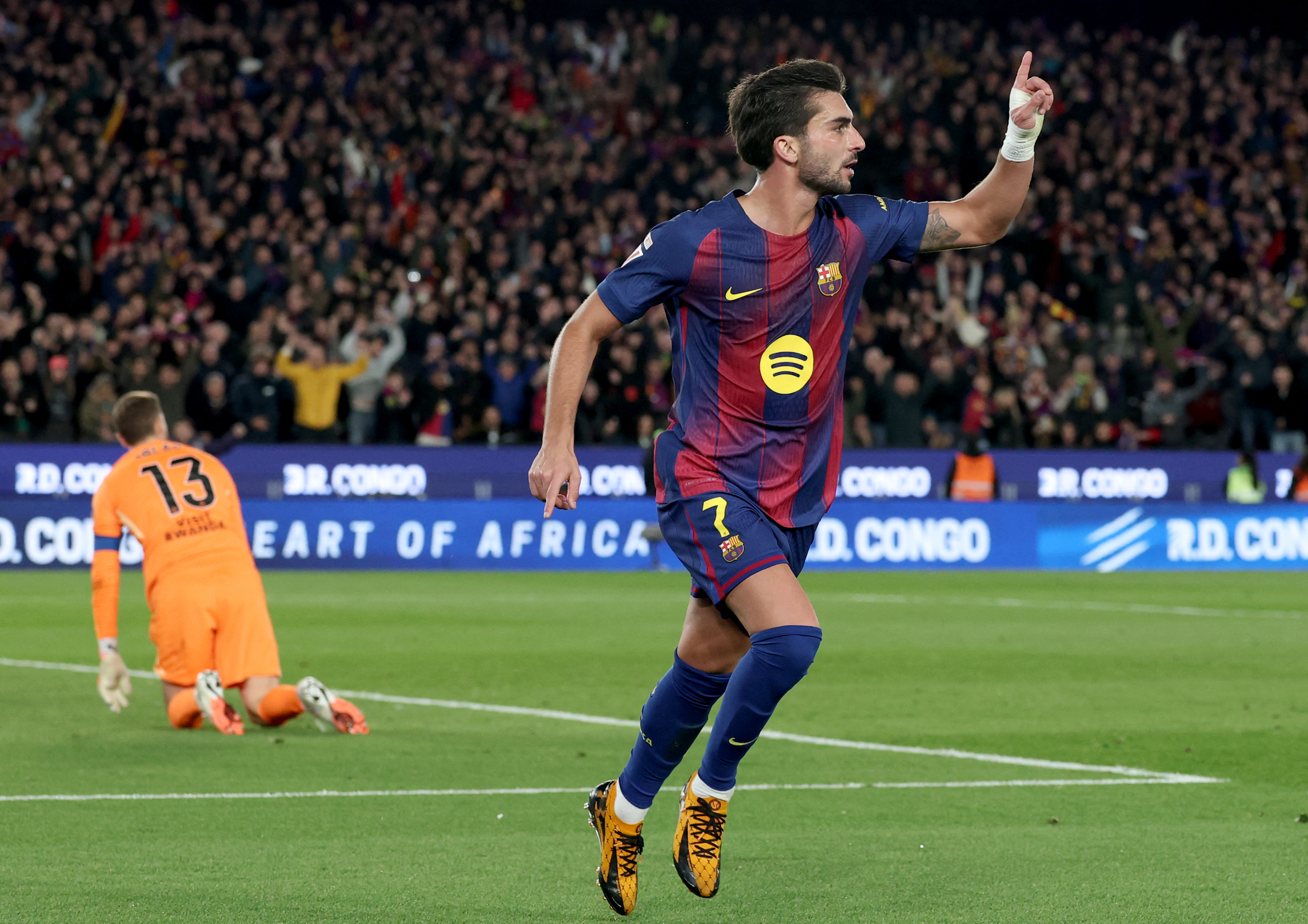 Barcelona's Spanish forward #07 Ferran Torres celebrates scoring his team's third goal during the Spanish league football match between FC Barcelona and Club Atletico de Madrid at Camp Nou Stadium in Barcelona on December 2, 2025. (Photo by Lluis GENE / AFP)