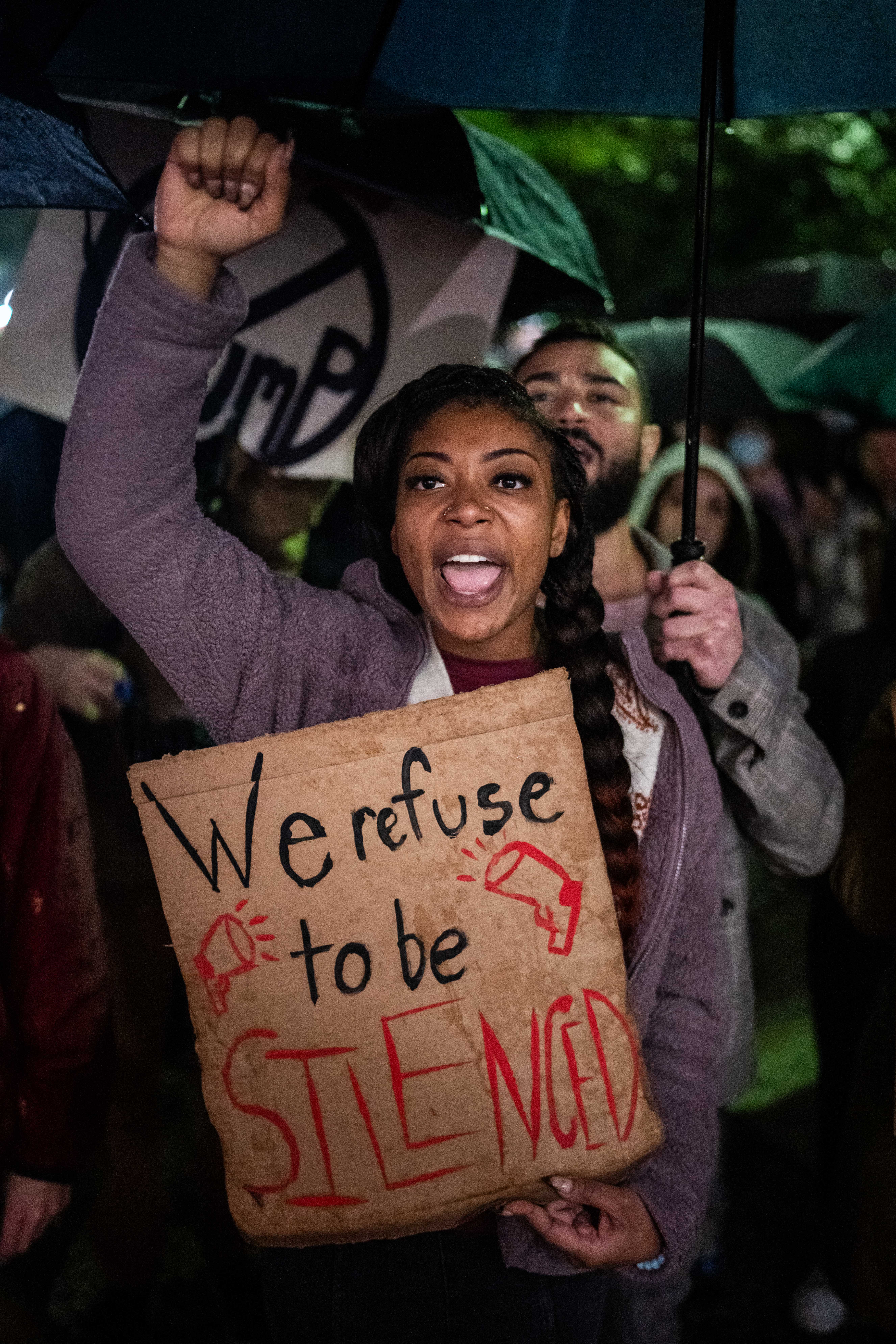 People protest against the ICE and Border Patrol operation outside of City Hall in New Orleans, Louisiana, on December 1, 2025.