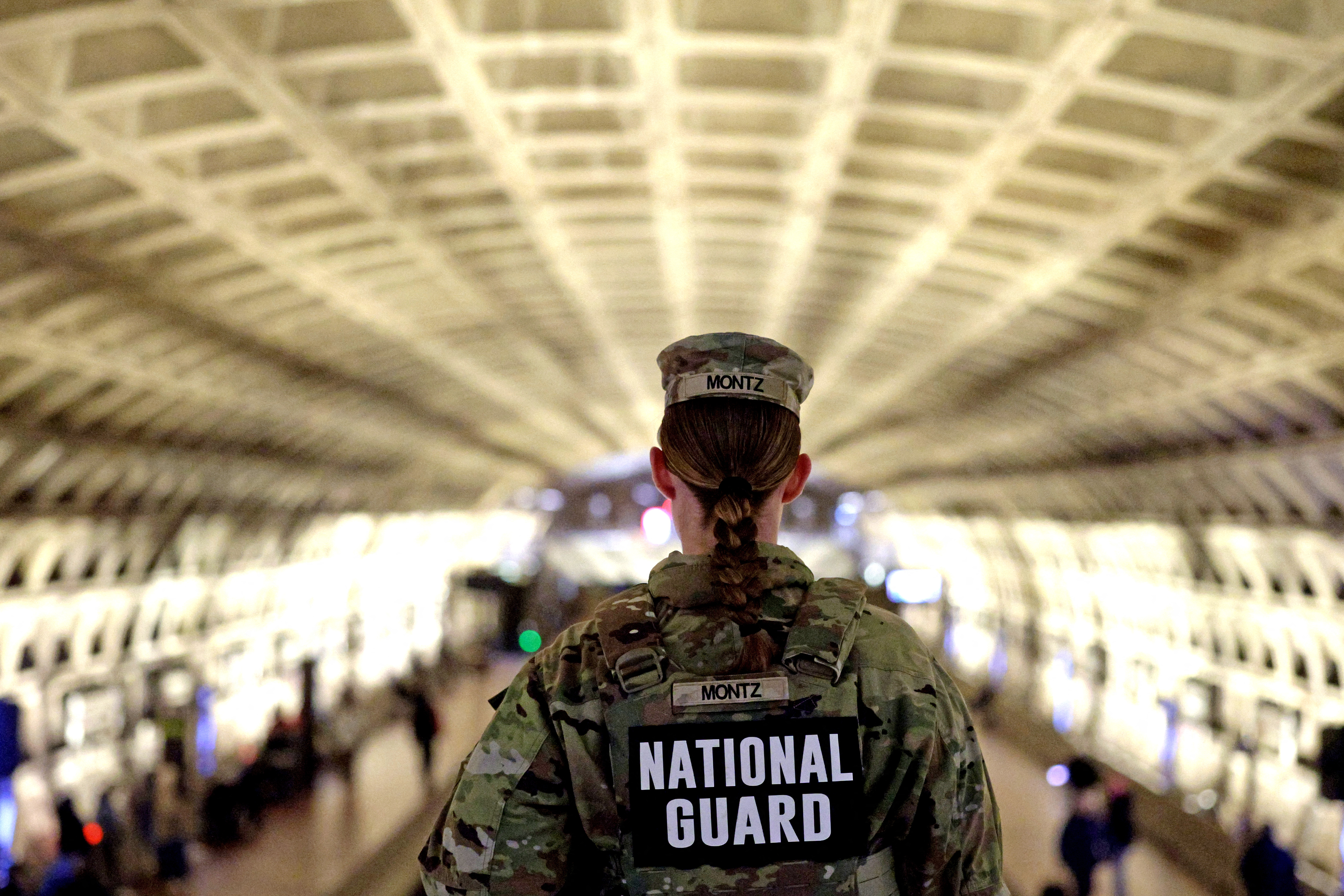 WASHINGTON, DC - DECEMBER 03: A member of the National Guard patrols at Gallery Place Metro Station on December 3, 2025 in Washington, DC. The National Guard continues their presence, under an executive order by President Donald Trump, in the nation’s capital after two members were shot by a suspected gunman. Rahmanullah Lakanwal, an Afghan immigrant who had worked with the CIA, shot and killed Army Spc. Sarah Beckstrom and wounded Air Force Staff Sgt. Andrew Wolfe blocks away from the White House on November 26, a day before Thanksgiving. Alex Wong/Getty Images/AFP (Photo by ALEX WONG / GETTY IMAGES NORTH AMERICA / Getty Images via AFP)
