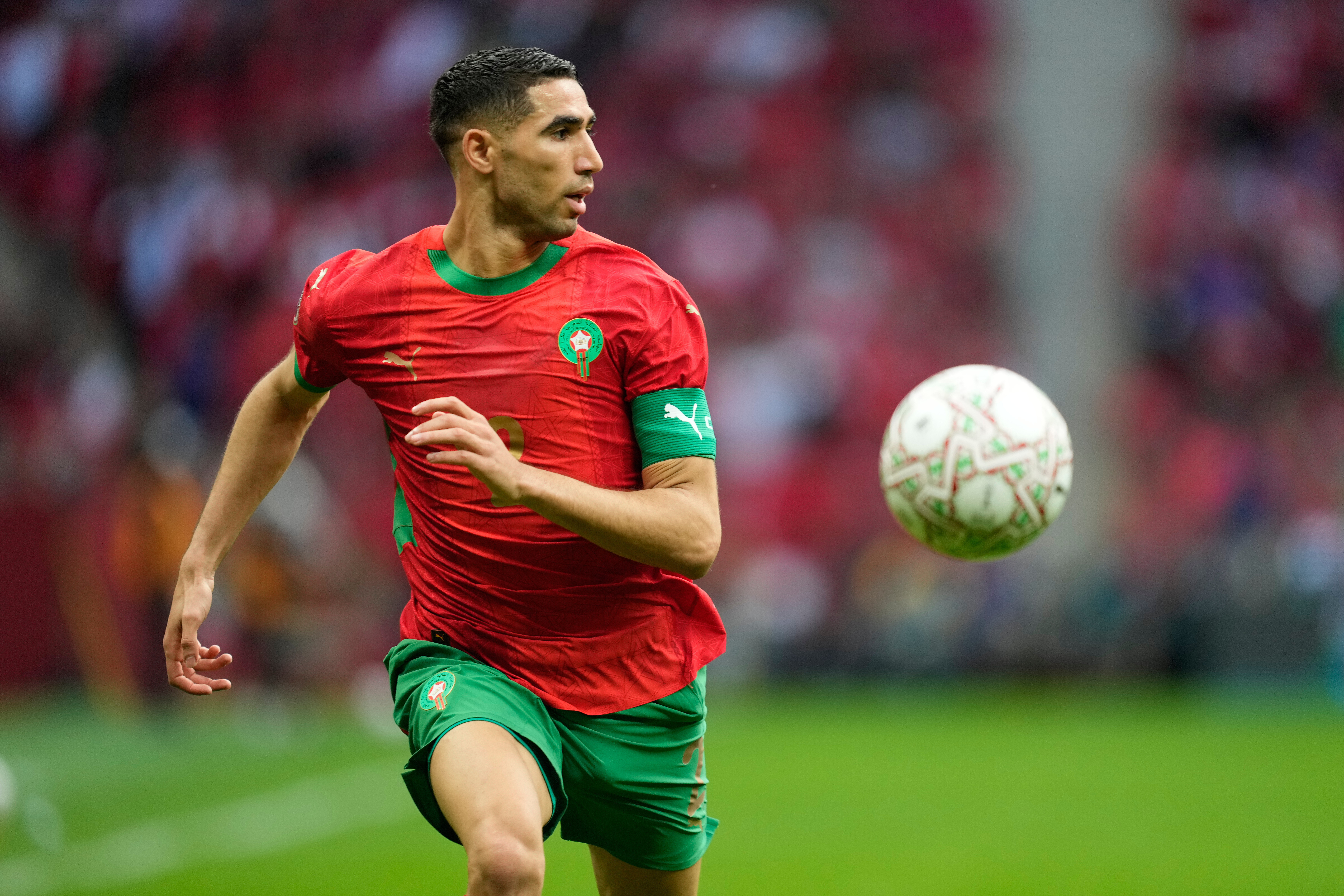 Morocco's Achraf Hakimi runs with the ball.