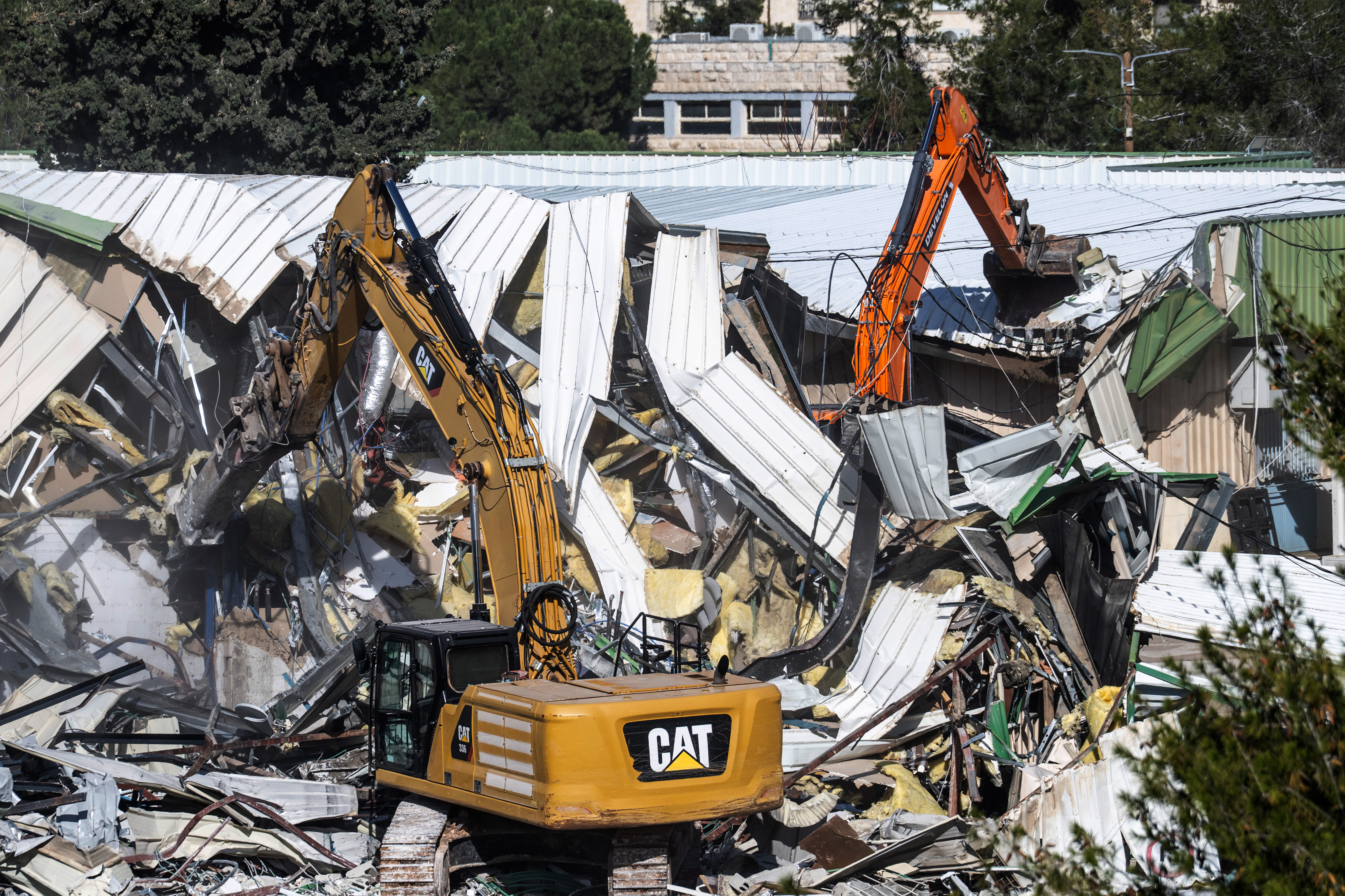 epa12663901 Israeli bulldozers demolish parts of the headquarter of the United Nations Relief and Works Agency (UNRWA) in the east Jerusalem neighborhood of Sheikh Jarrah, 20 January 2026. EPA/ATEF SAFADI