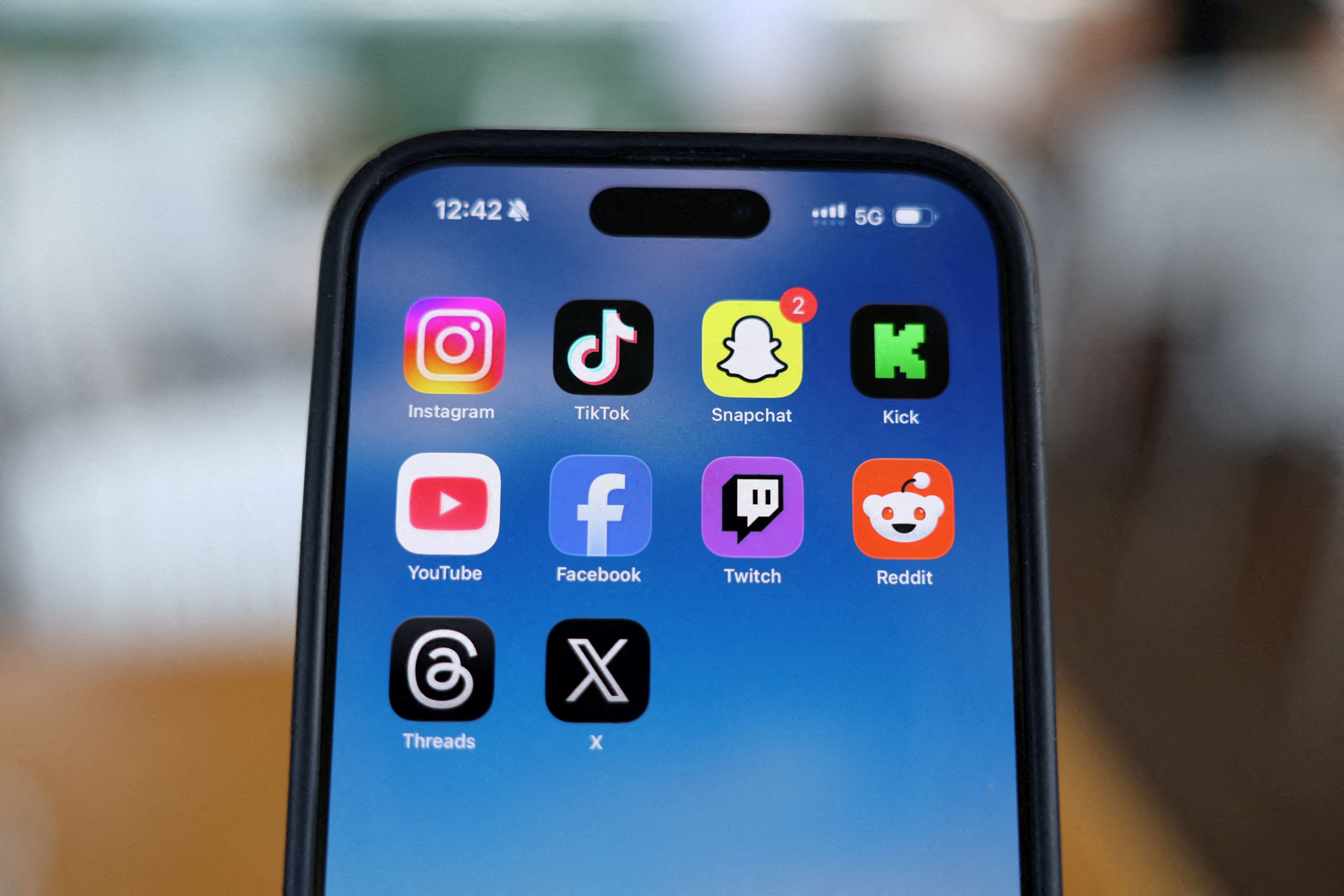 Social media applications displayed on a mobile phone