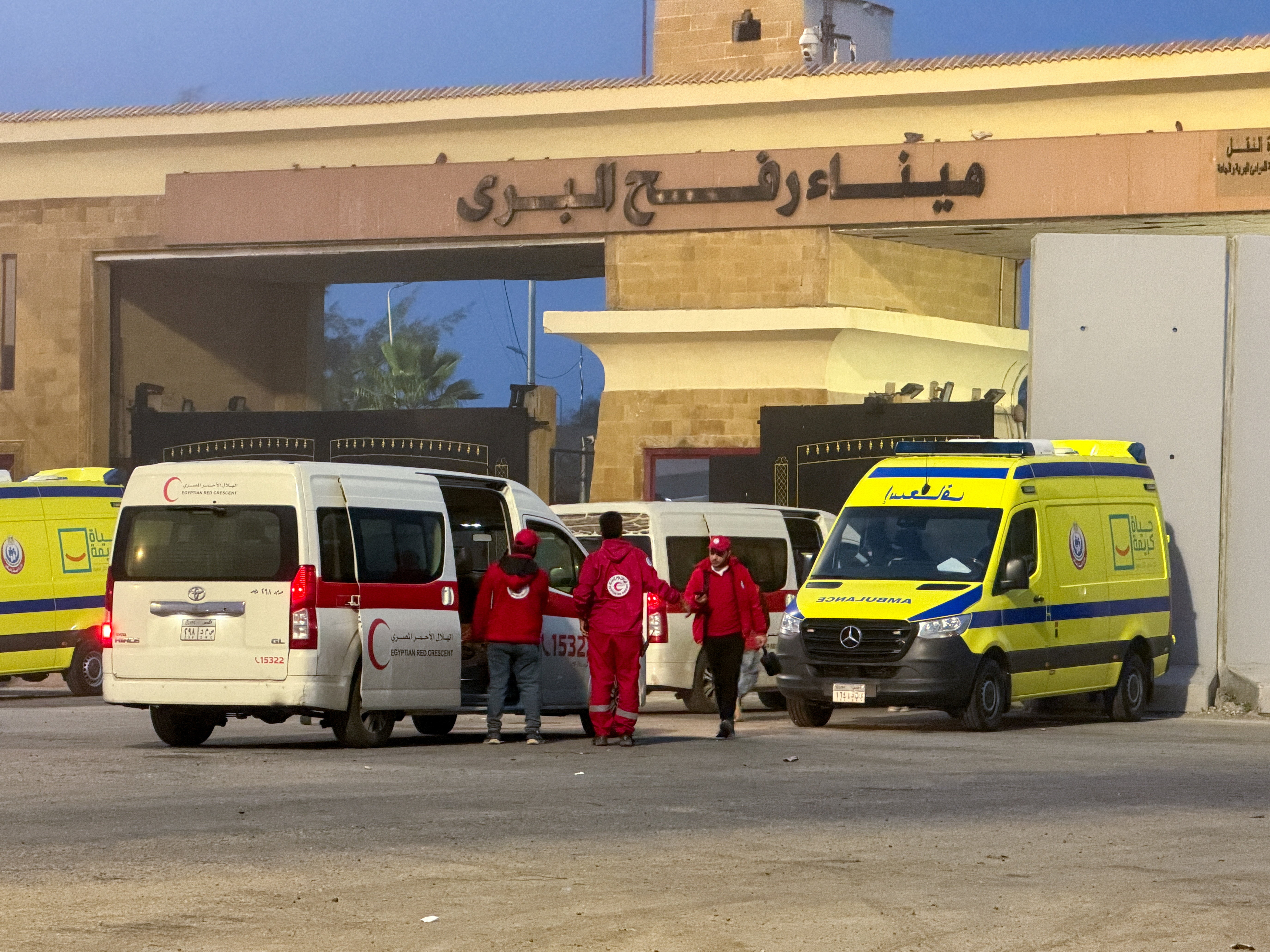 Egyptian ambulances go through the Rafah border crossing.