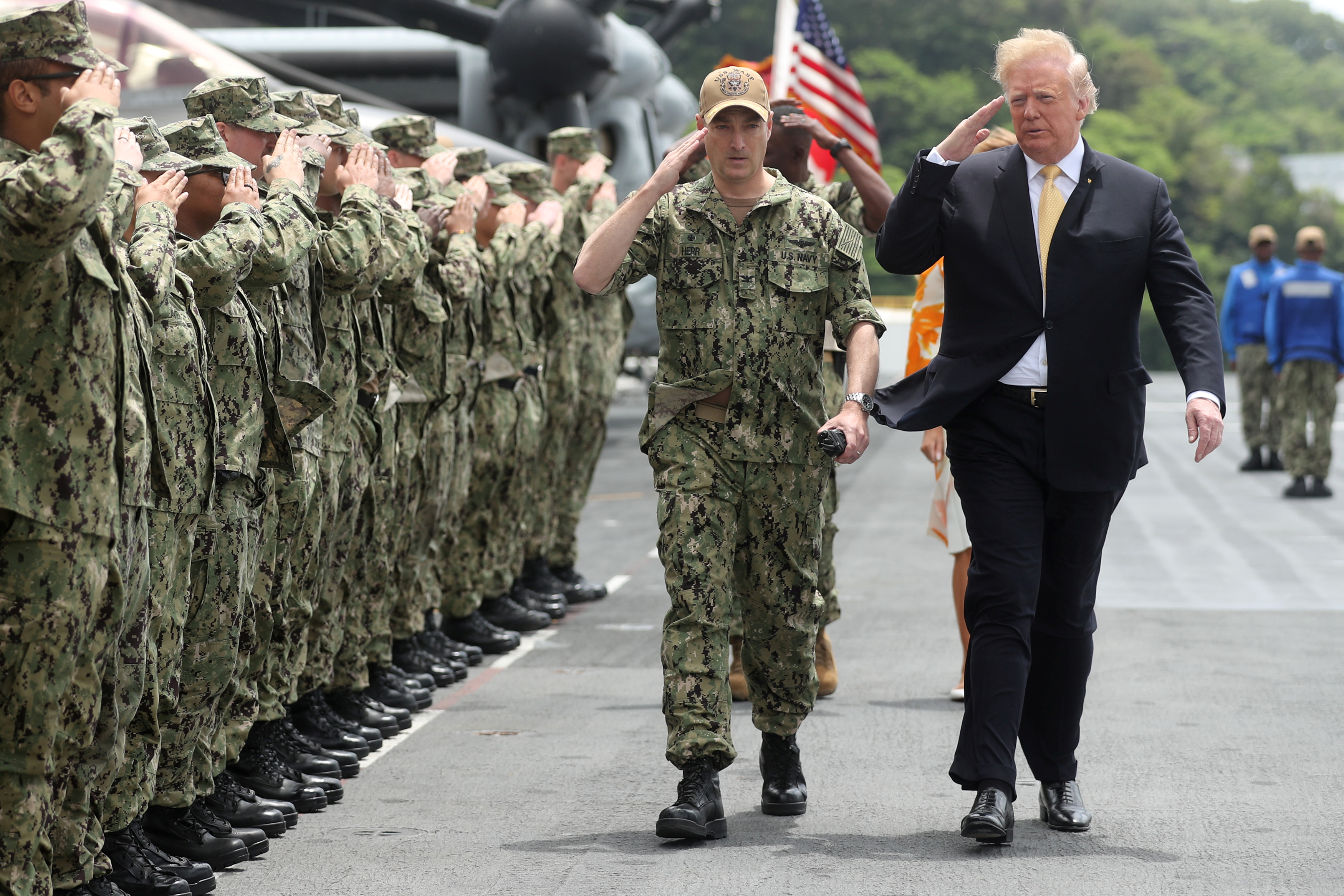 U.S. President Donald Trump salutes troops aboard the USS Wasp (LHD 1) in Yokosuka, south of Tokyo, Japan