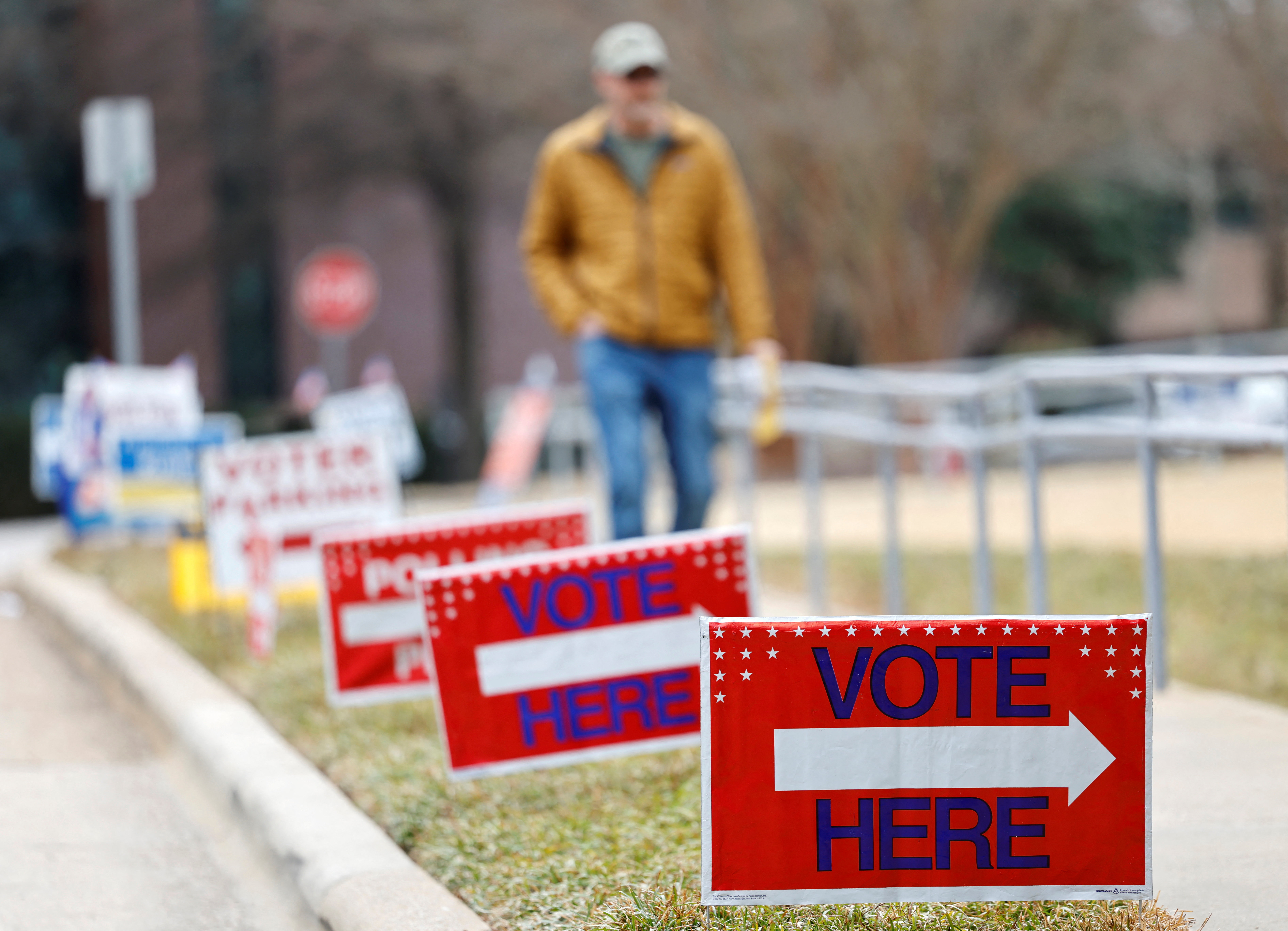 A voter walks towards his polling place during the state’s primary election to choose candidates for the November midterm elections, in Cary, North Carolina, U.S., March 3, 2026. REUTERS/Jonathan Drake