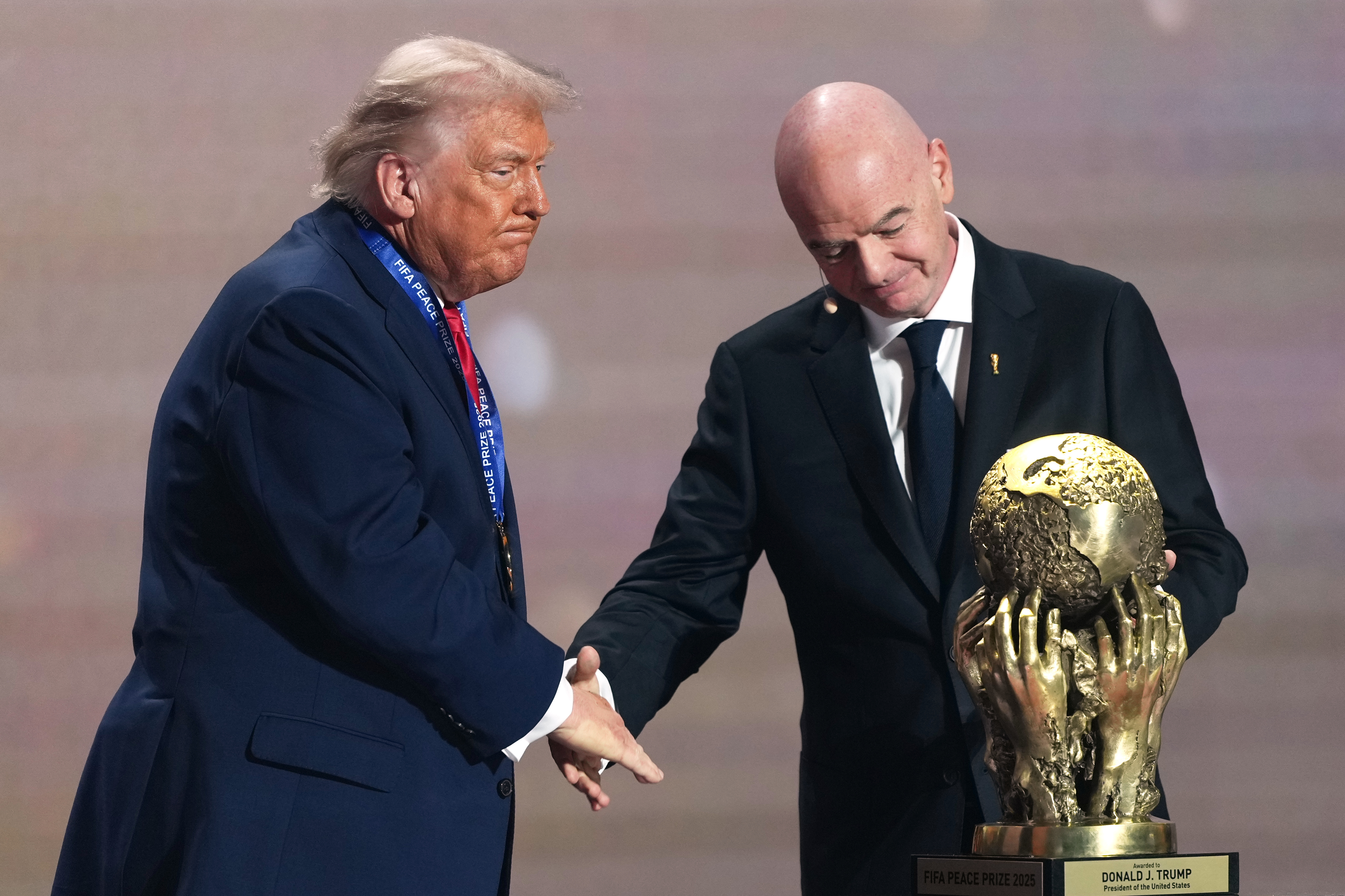 FIFA President Gianni Infantino presents US President Donald Trump with the FIFA Peace Prize.
