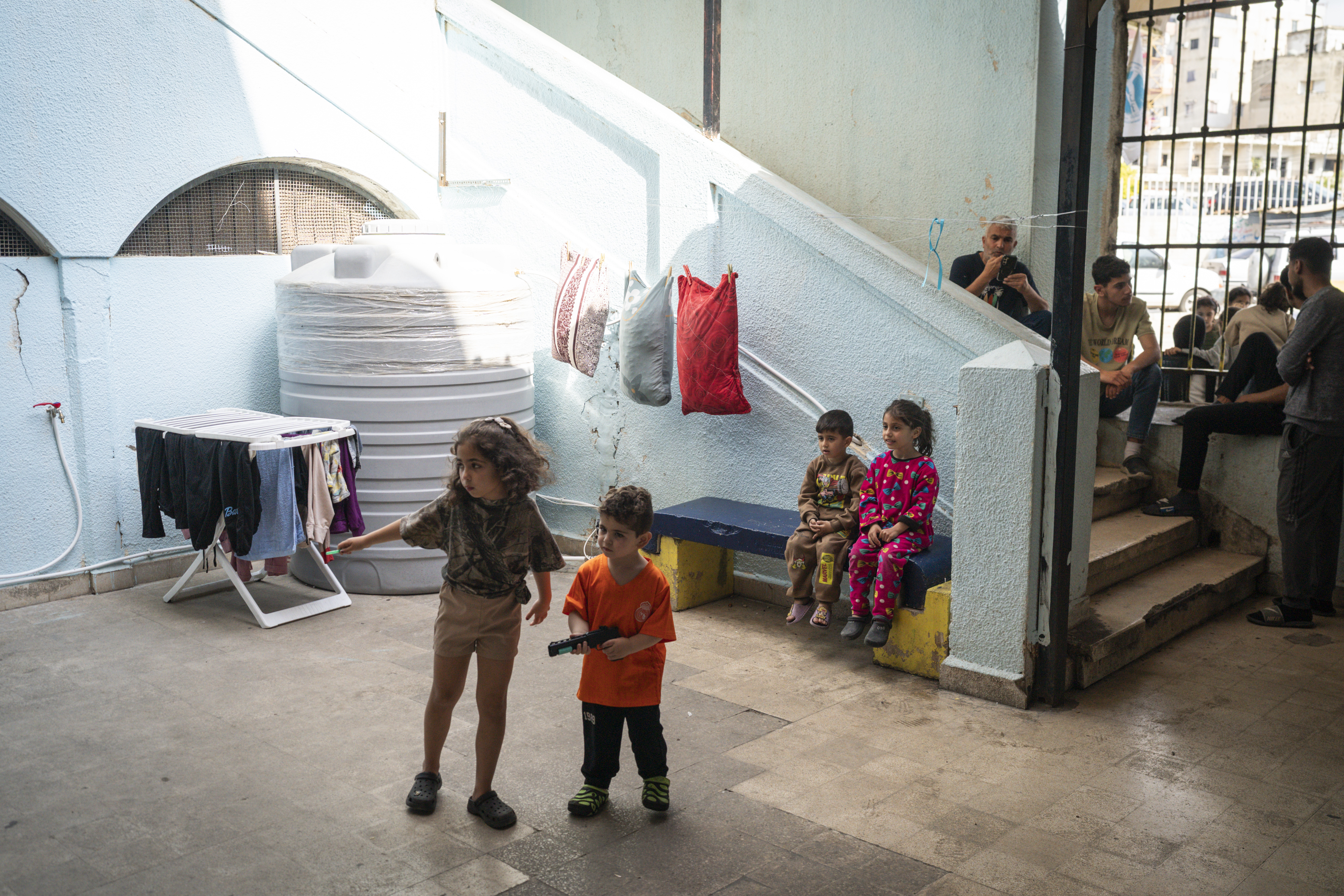 SIDON, LEBANON - APRIL 27: Children play in a shelter for internal displaced people on April 27, 2026 in Sidon (Saida), Lebanon. Around 50 of the roughly 300 people seeking refuge here had gone home to southern Lebanon before soon returning, as Israel has traded attacks with Hezbollah despite the ongoing ceasefire agreement. Yesterday, Lebanon authorities said 14 people were killed in Israeli attacks in the country, while Israel said one of its soldiers was killed in an attack by Hezbollah. (Photo by Adri Salido/Getty Images)