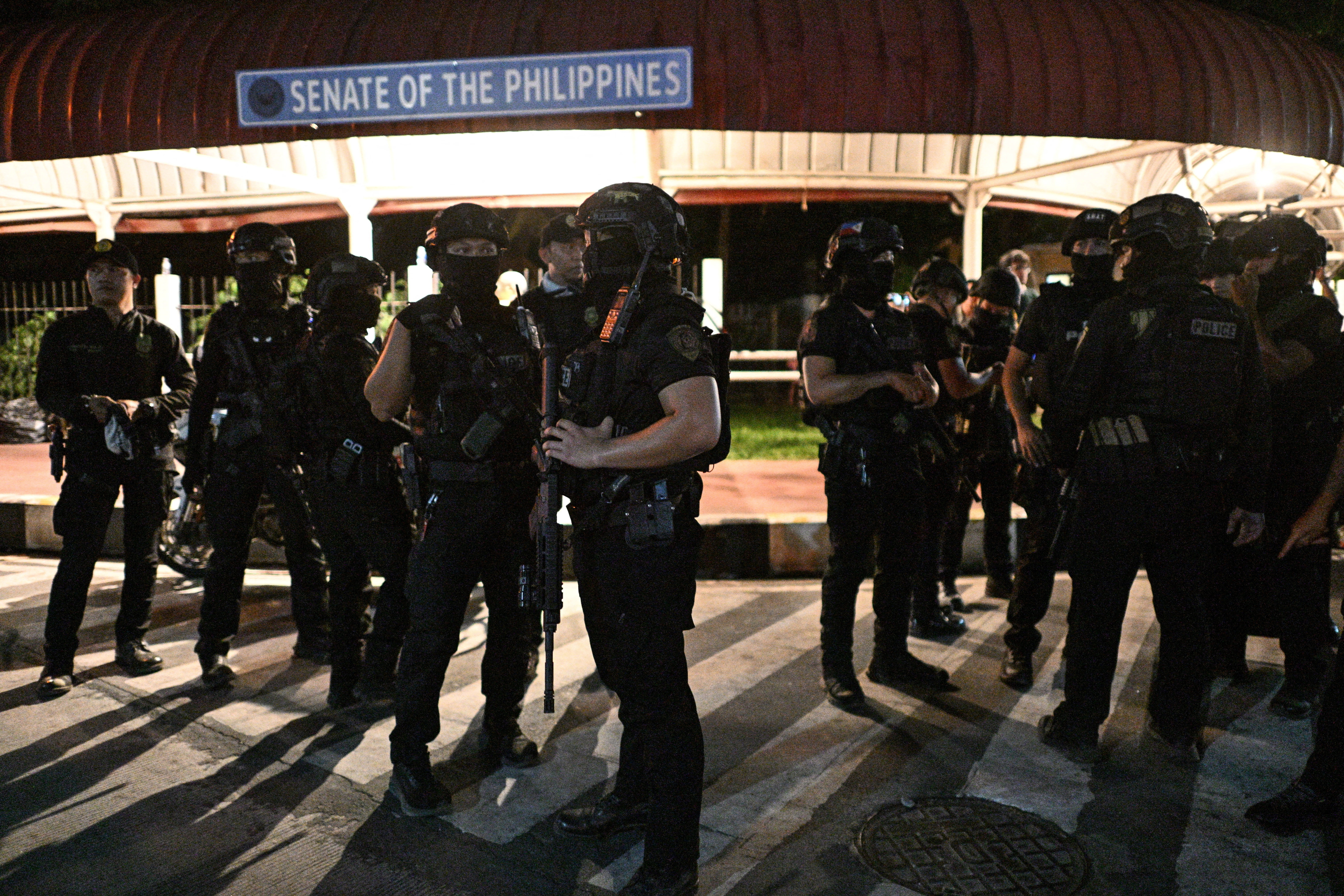 SWAT members stand outside the Philippine Senate, which holds Senator Ronald "Bato" dela Rosa, the chief enforcer of former President Rodrigo Duterte's drug war, in protective custody amid an International Criminal Court warrant, Pasay City, Metro Manila, Philippines, May 13, 2026. REUTERS/Noel Celis