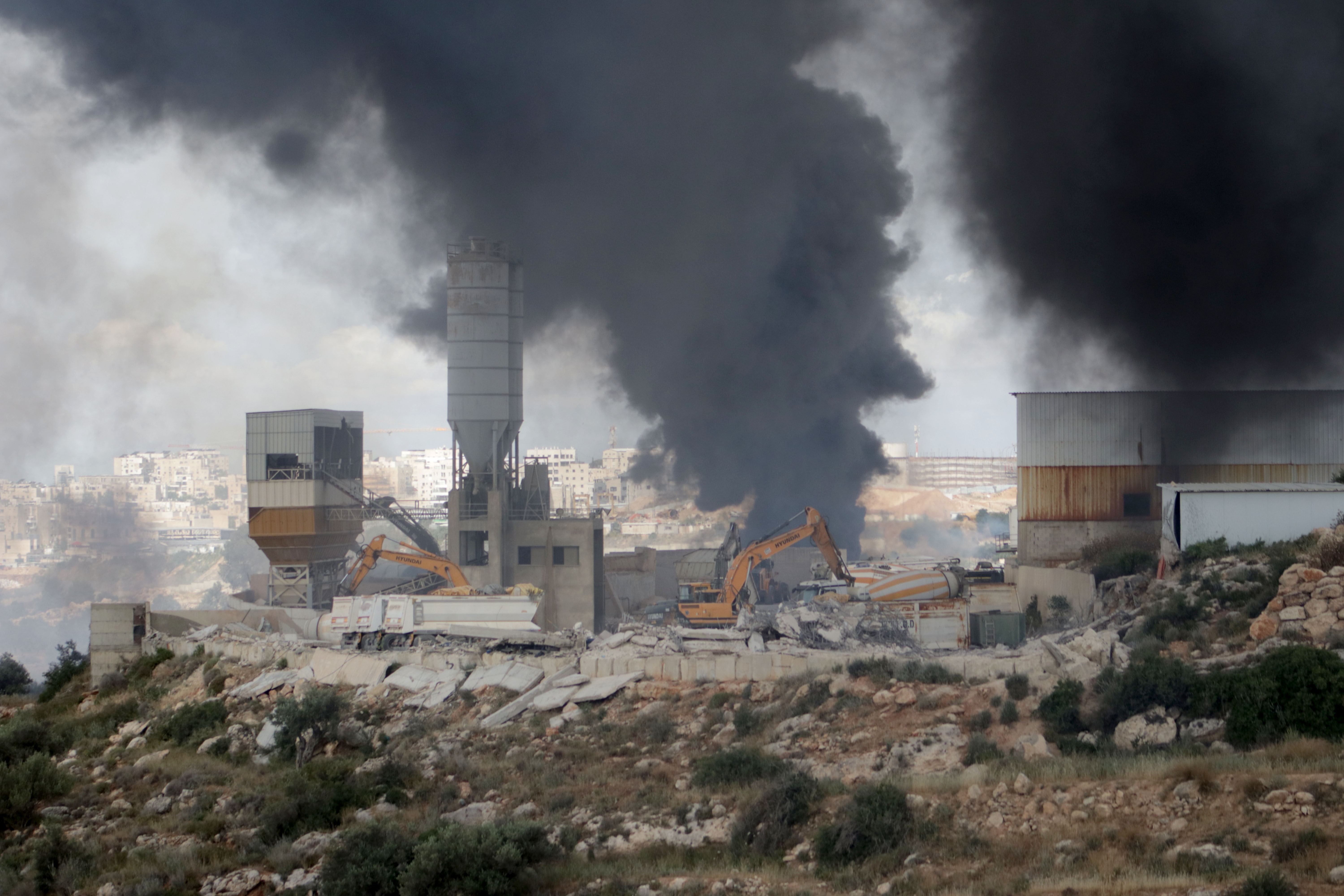 RAMALLAH, WEST BANK, PALESTINE - MAY 20: A view of the destruction after Israeli bulldozers demolished a cement factory in the village of Kharbatha Bani Harith, during a raid in west of Ramallah, West Bank, Palestine on May 20, 2026. The Israeli army carried out raids in the northern and central parts of the West Bank, demolishing Palestinian homes and commercial structures in various areas. ( Issam Rimawi - Anadolu Agency )