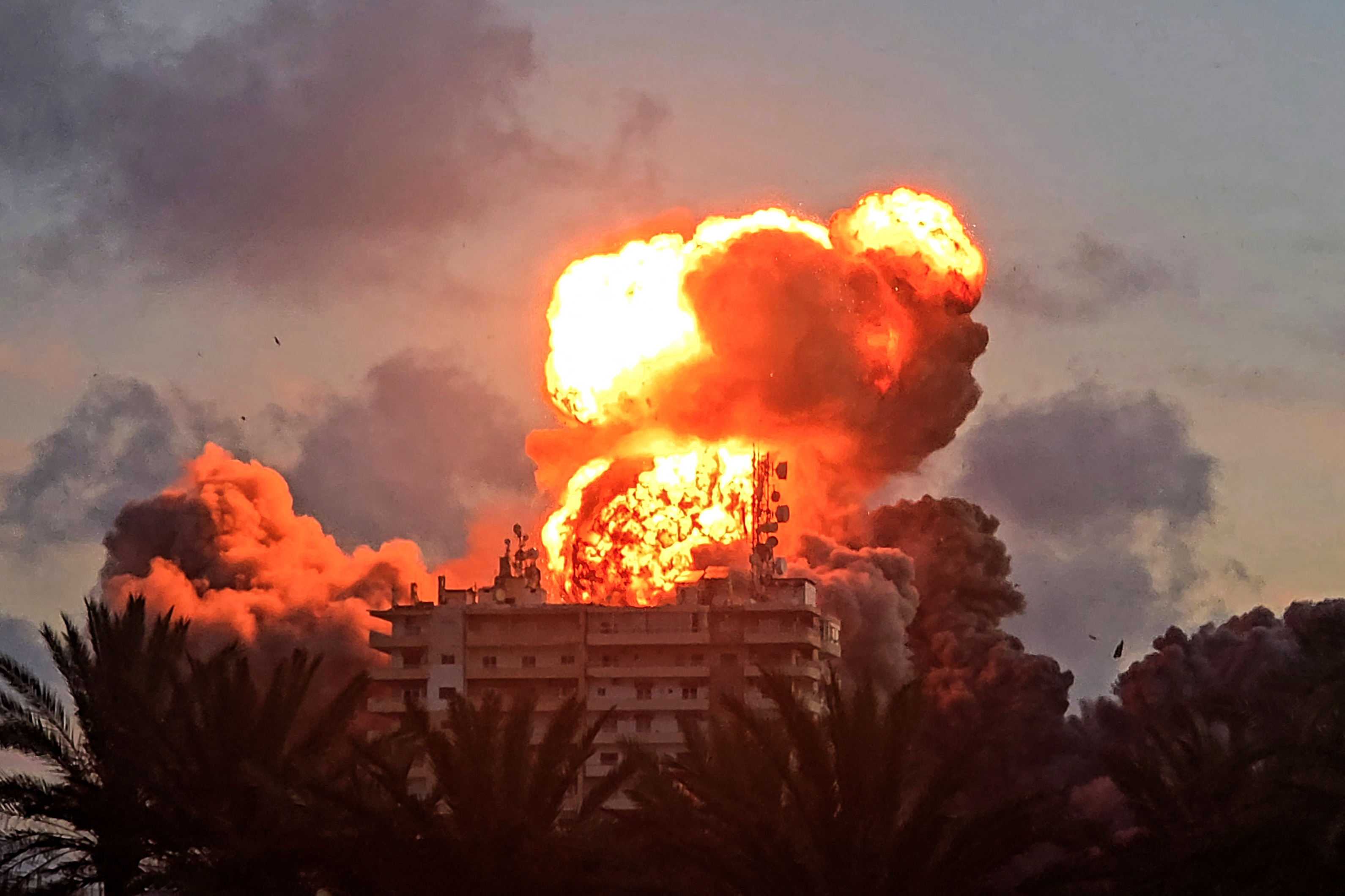 A fireball erupts from a building following an Israeli strike in Tyre, southern Lebanon, on May 28, 2026. The Israeli military said on May 28 it had begun new strikes on Hezbollah infrastructure around the southern Lebanese city of Tyre after issuing an evacuation warning to its residents. (Photo by KAWANT HAJU / AFP)