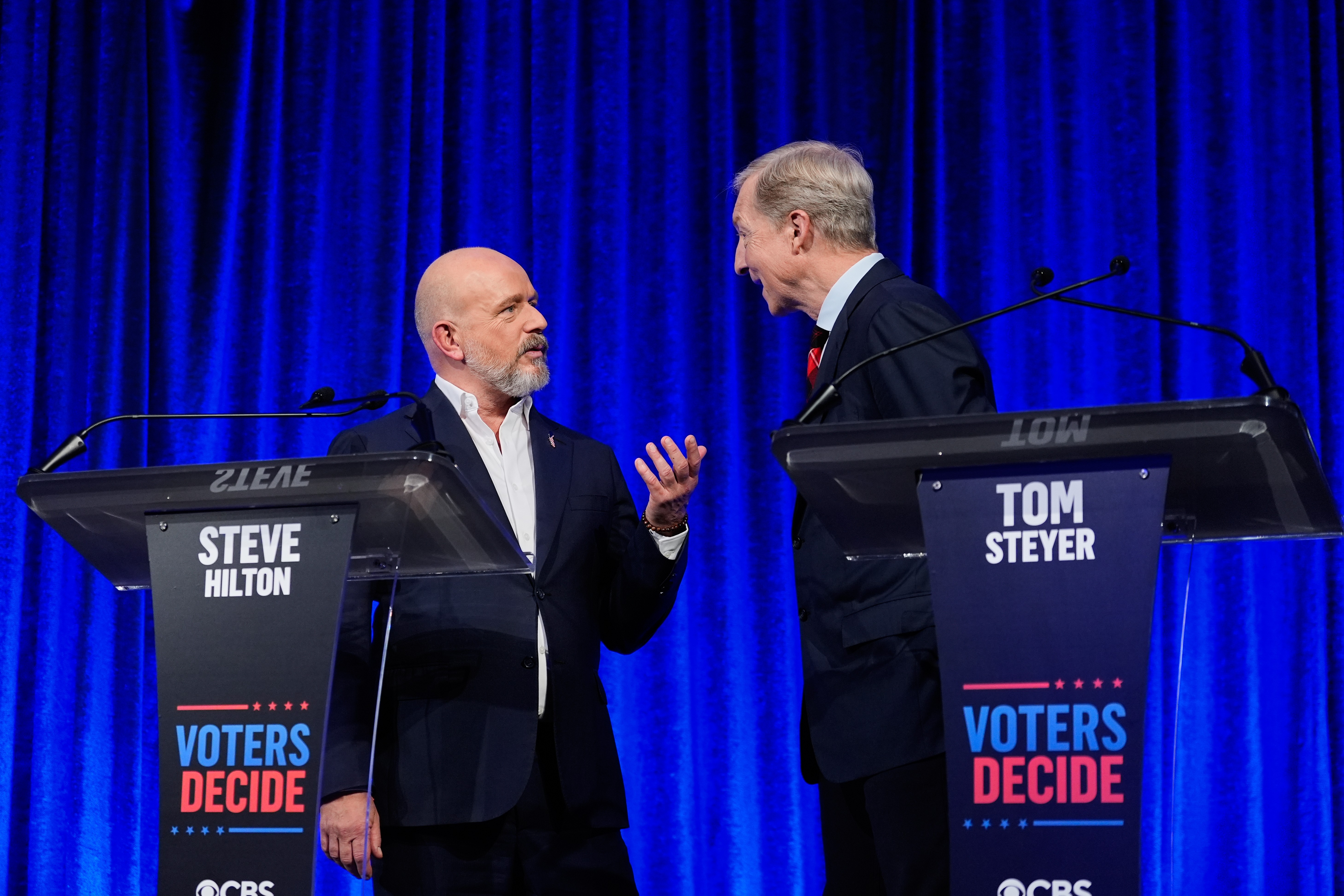 Steve Hilton and Tom Steyer speak during a break in a California gubernatorial debate hosted by CBS Bay Area and the San Francisco Examiner in San Francisco, Thursday, May 14, 2026.