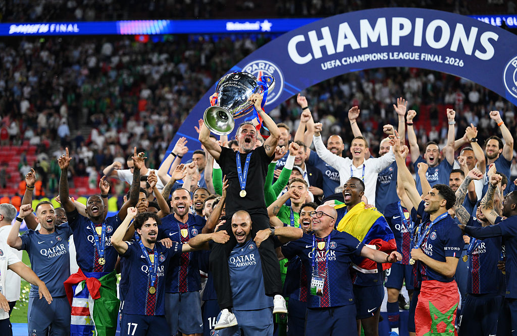 Luis Enrique, Head Coach of Paris Saint-Germain, lifts the UEFA Champions League trophy