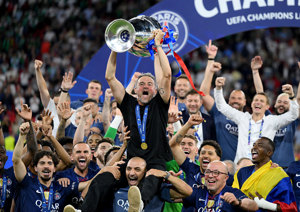 Luis Enrique, Head Coach of Paris Saint-Germain, lifts the UEFA Champions League trophy