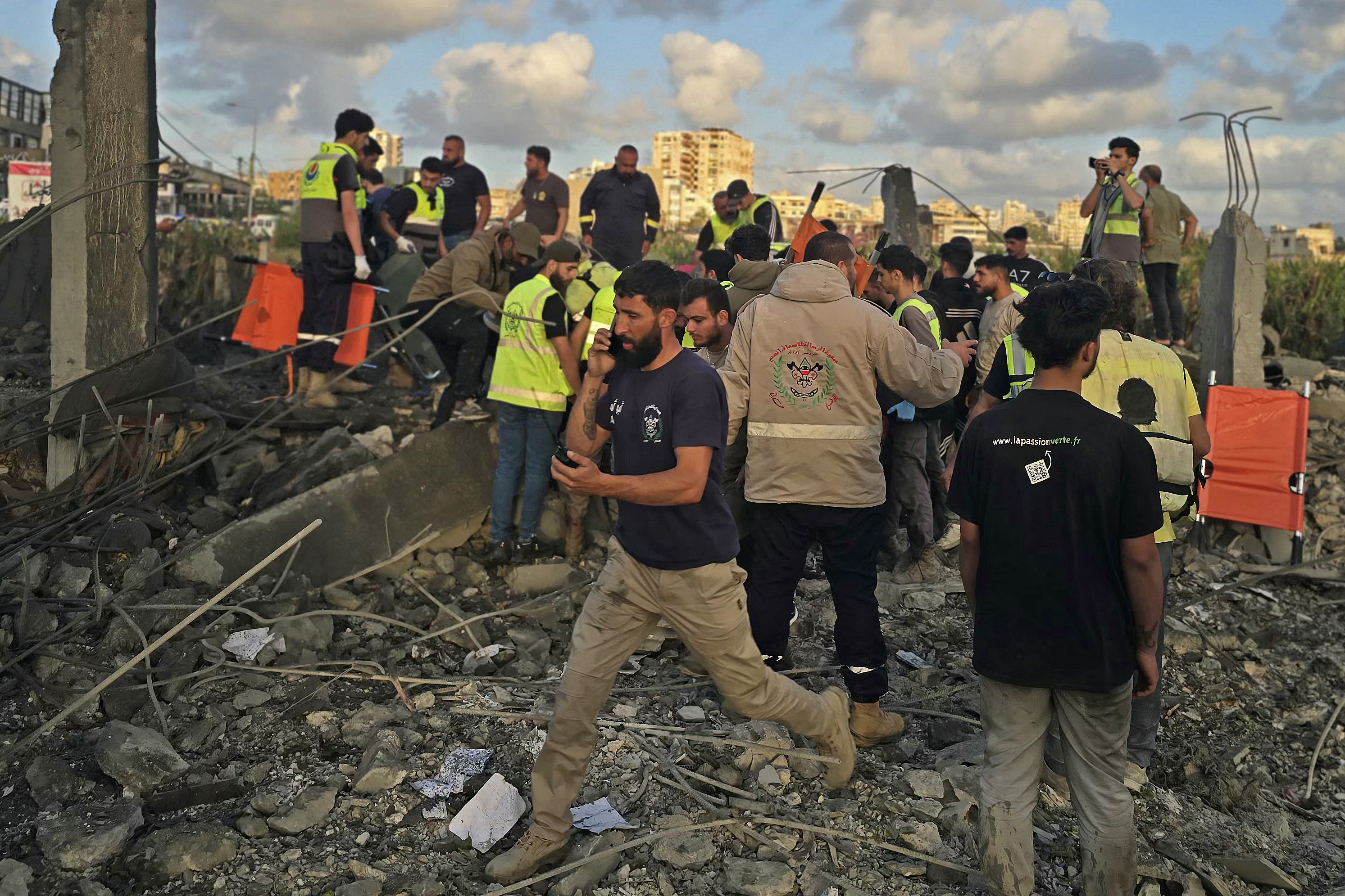 First responders gather at the site of an Israeli airstrike that targeted an area in the suburbs of the southern Lebanon coastal city of Tyre on May 16, 2026.