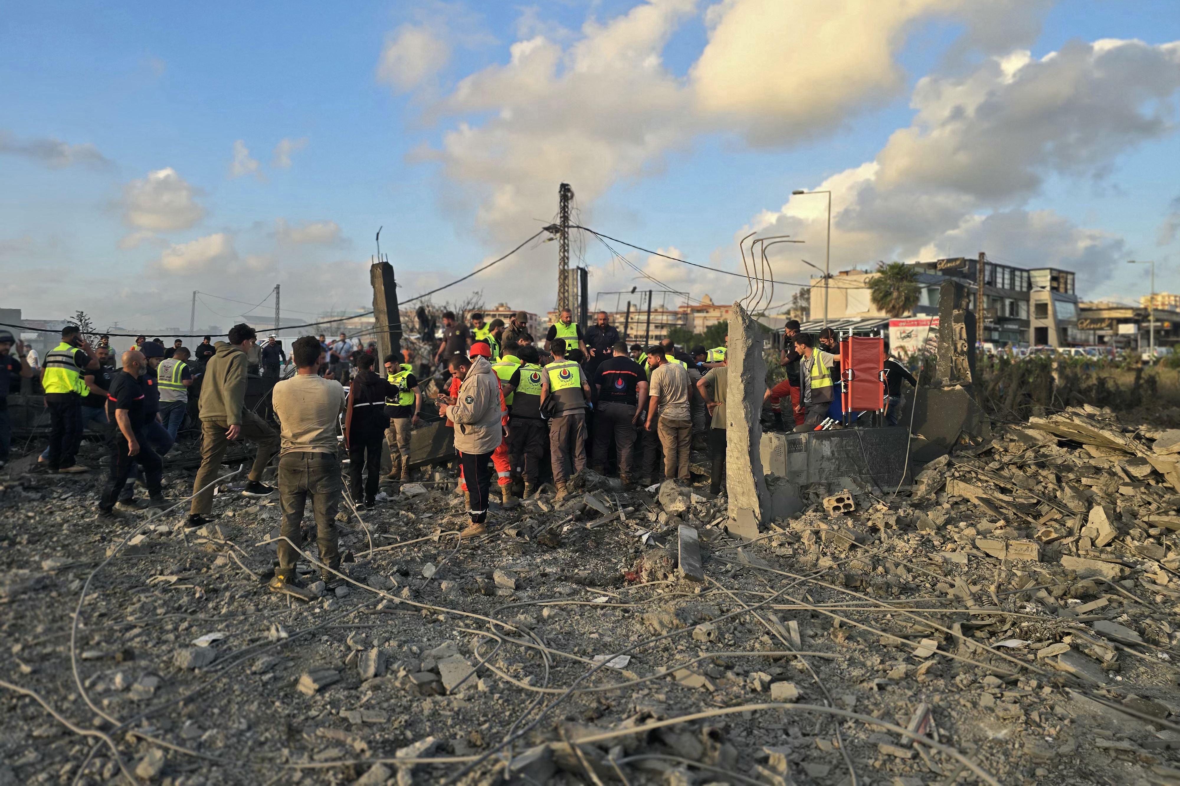First responders gather at the site of an Israeli airstrike that targeted an area in the suburbs of the southern Lebanon coastal city of Tyre on May 16, 2026.