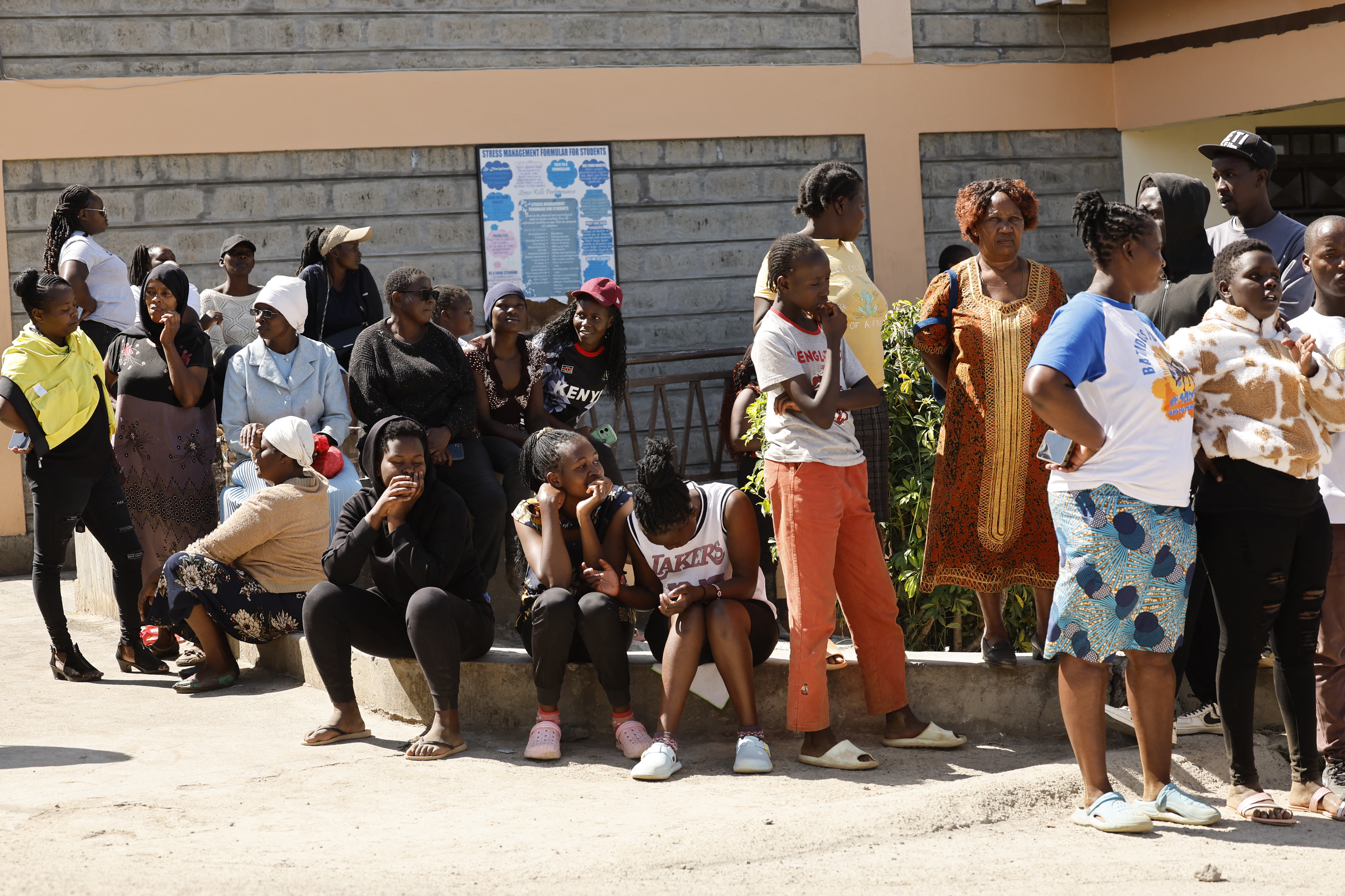 Relatives gather and wait for news of their loved ones at the Utumishi Girls Academy following the deadly fire in Gilgil, north of the capital Nairobi on May 28, 2026.