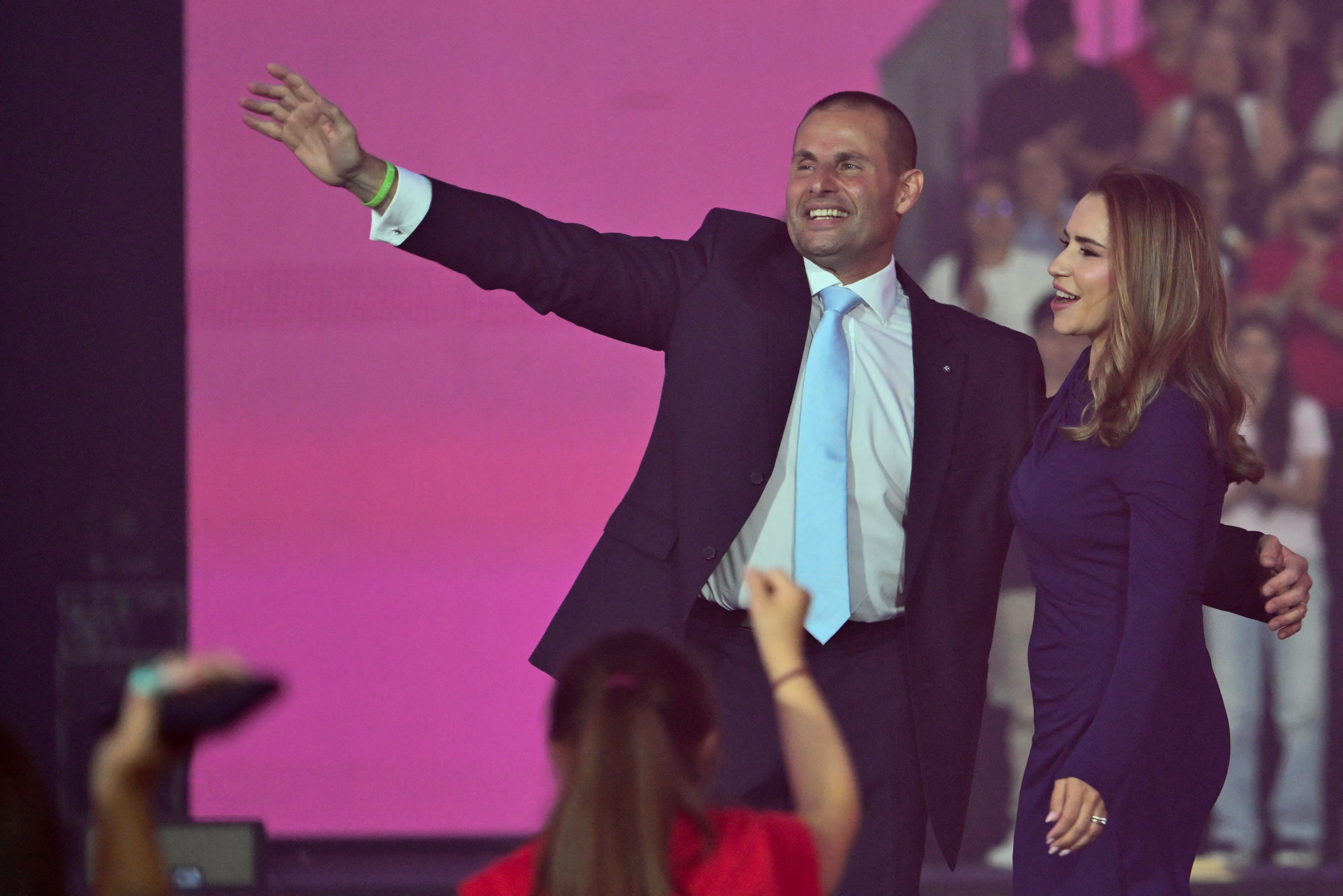 Malta's Prime Minister and leader of the Labour Party Robert Abela and his wife Lydia Abela wave to supporters.