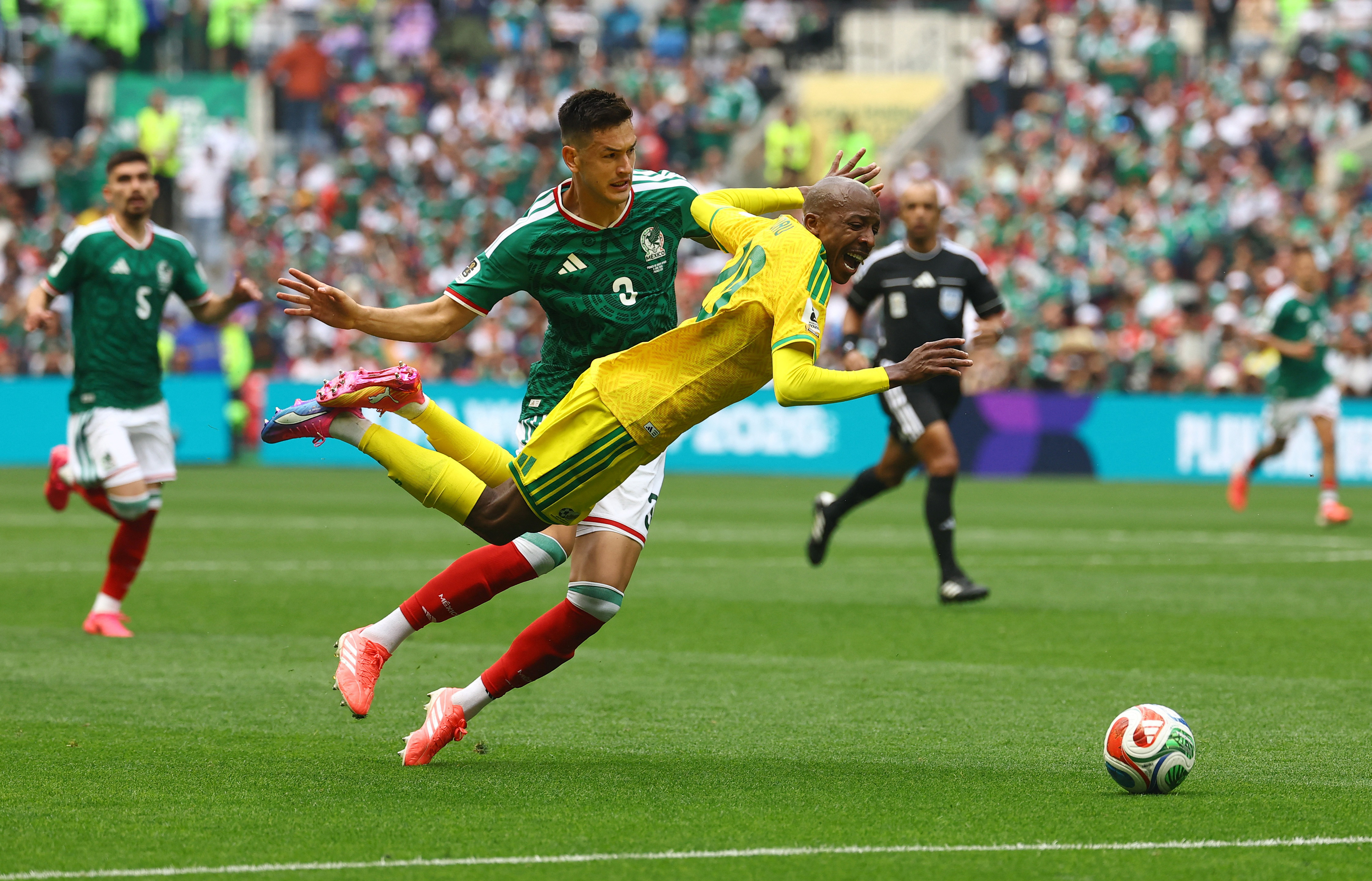 Mexico's Cesar Montes fouls South Africa's Khuliso Mudau and is later sent off