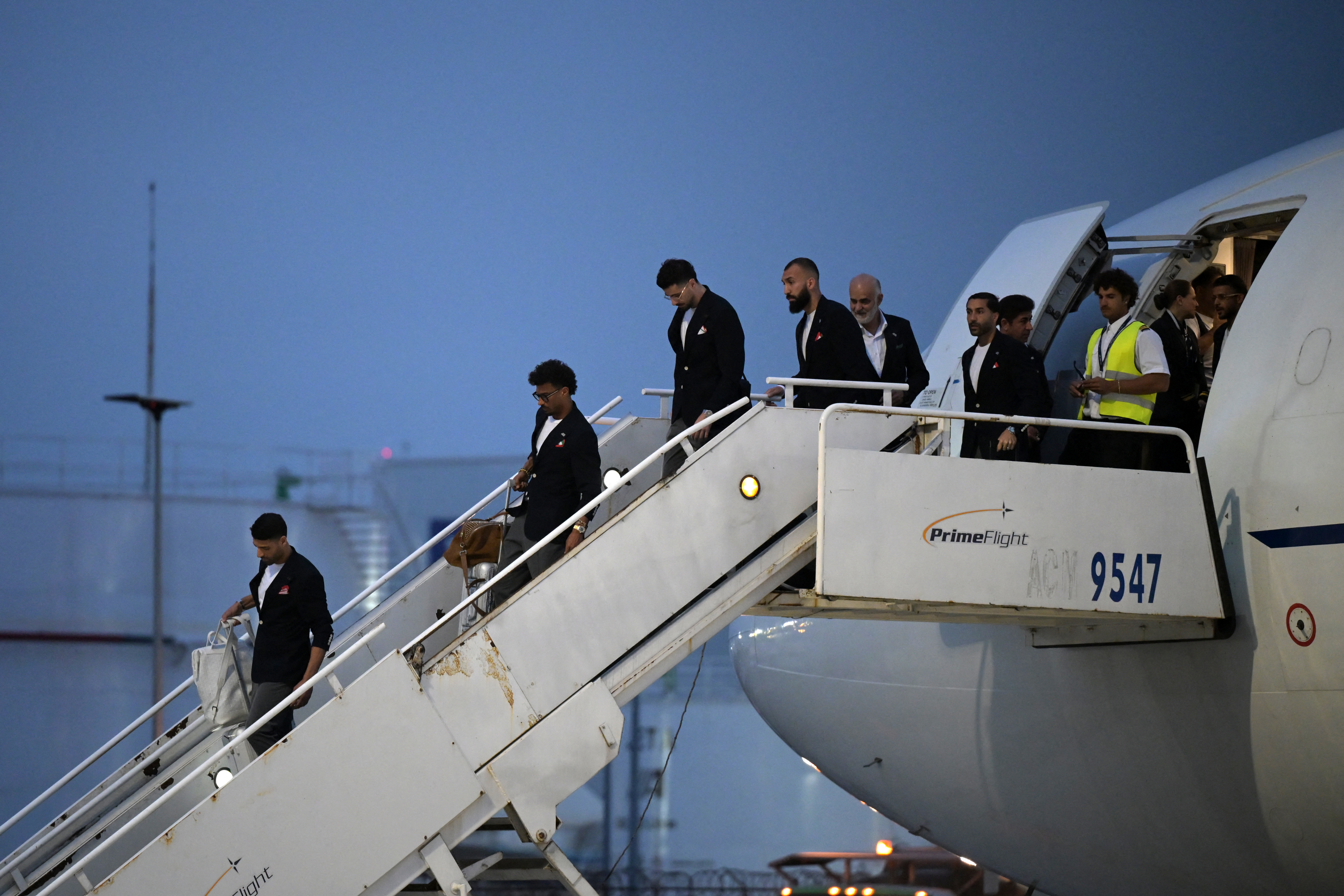 Iran's players disembark on arrival at the Tijuana International Airport in Tijuana, Mexico on June 7, 2026, ahead of the FIFA 2026 World Cup football tournament. (Photo by Guillermo Arias / AFP)