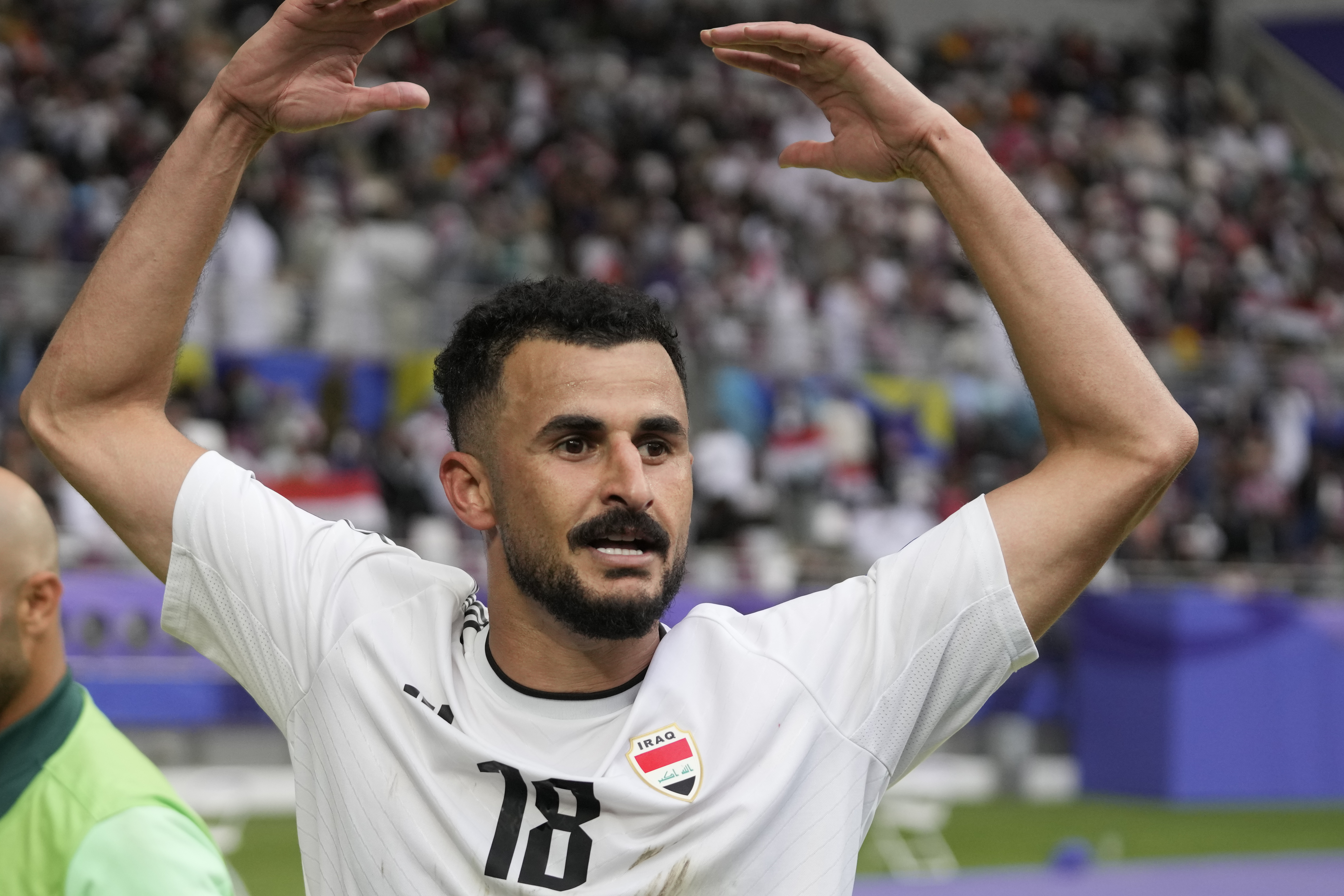 Iraq's Aymen Hussein celebrates after scoring his side's second goal during the Asian Cup Round of 16 soccer match between Iraq and Jordan, at Khalifa International Stadium in Doha, Qatar, Monday, Jan. 29, 2024. (AP Photo/Thanassis Stavrakis)