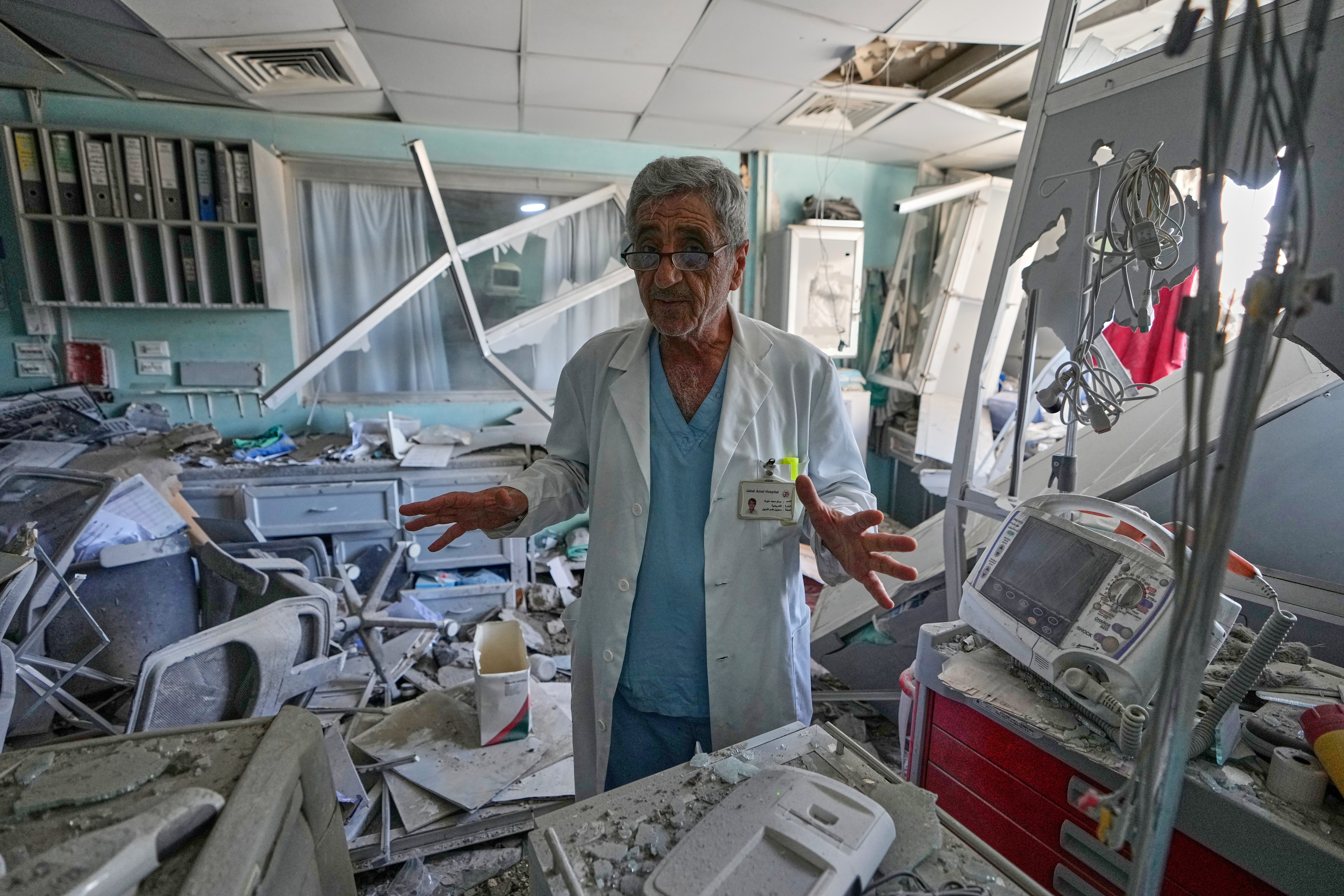 A doctor gestures at a damaged laboratory of Jabal Amel Hospital, following Monday's Israeli airstrike that was hit a nearby building, in the southern port city of Tyre, Lebanon, Tuesday, June 2, 2026. (AP Photo/Mohammed Zaatari)