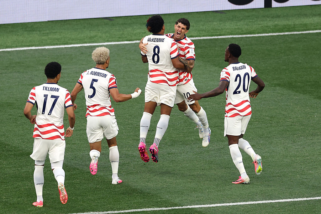 Christian Pulisic #10 and Weston McKennie #8 of the United States celebrate their side's first goal, an own goal by Damian Bobadilla #16 of Paraguay (not pictured), during the FIFA World Cup 2026 Group D match