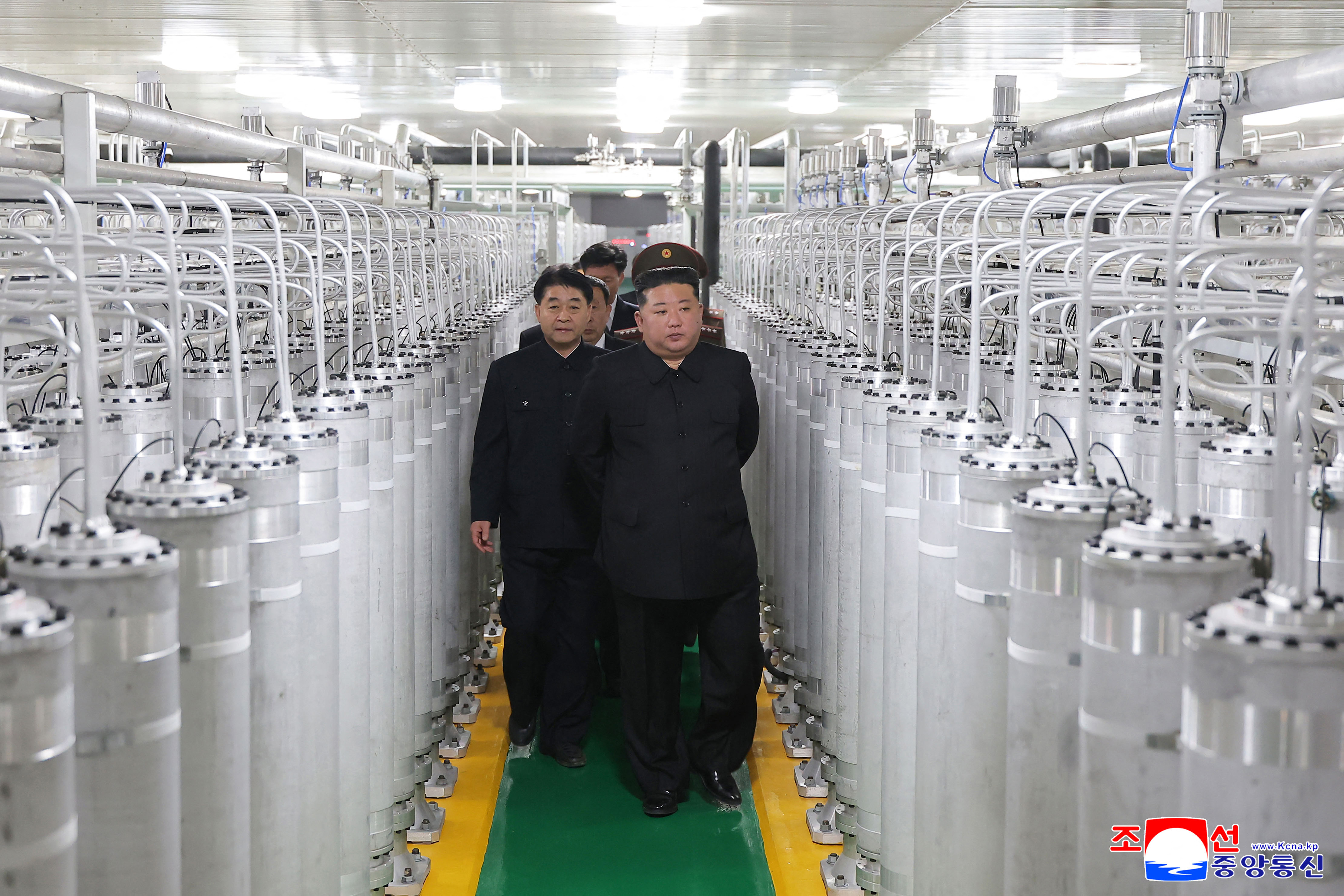 This picture taken on June 3, 2026 and released by North Korea's official Korean Central News Agency (KCNA) on June 4, 2026 shows North Korean leader Kim Jong Un (front R) inspecting the newly-inaugurated nuclear materials production factory at an undisclosed location in North Korea.