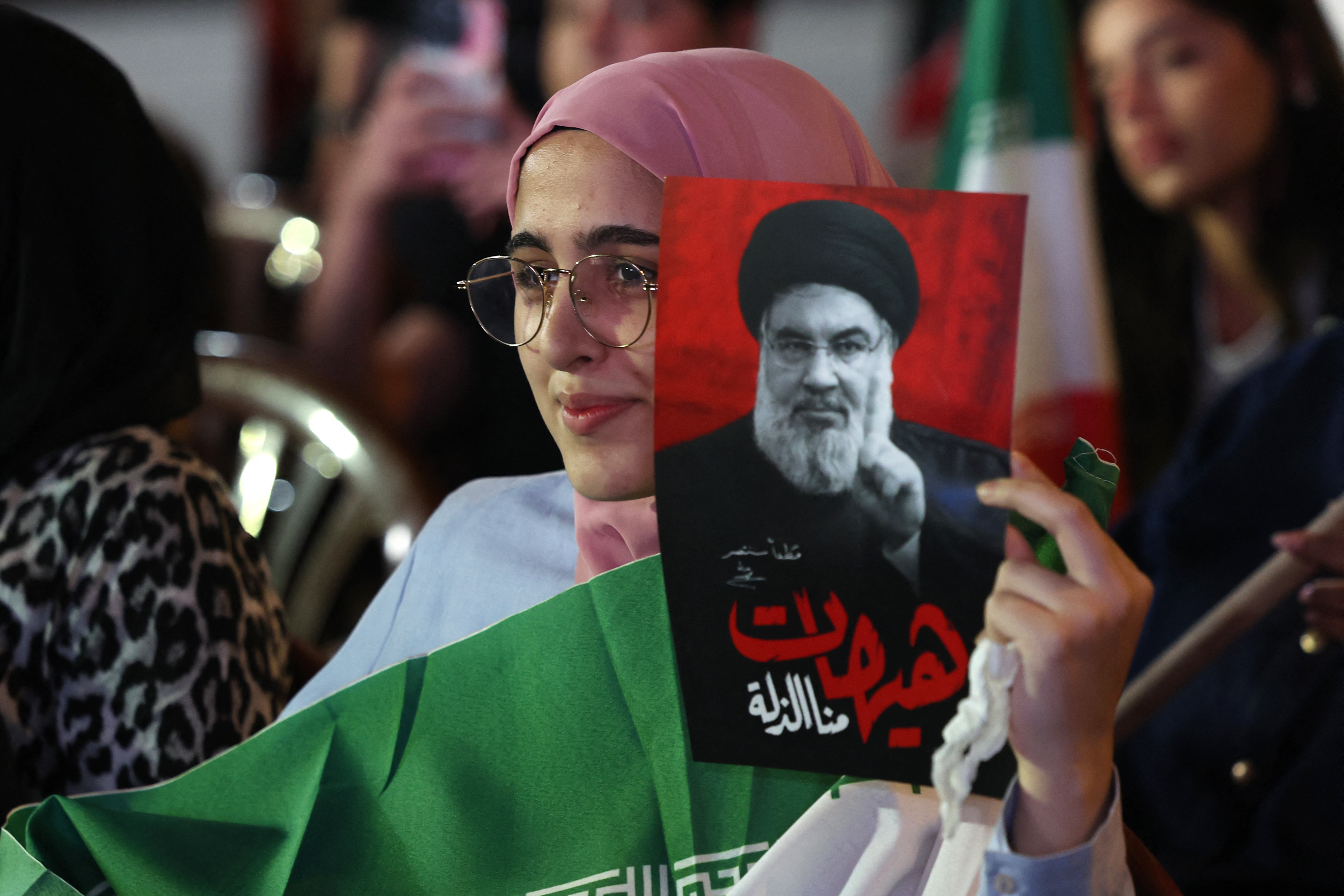 A supporter of Iran-backed armed group Hezbollah, holds a portrait of slain leader Hassan Nasrallah during an anti-US and anti-Israel protest organised by the International Popular Committees to Resist Aggression in Beirut’s southern suburbs on June 10, 2026.