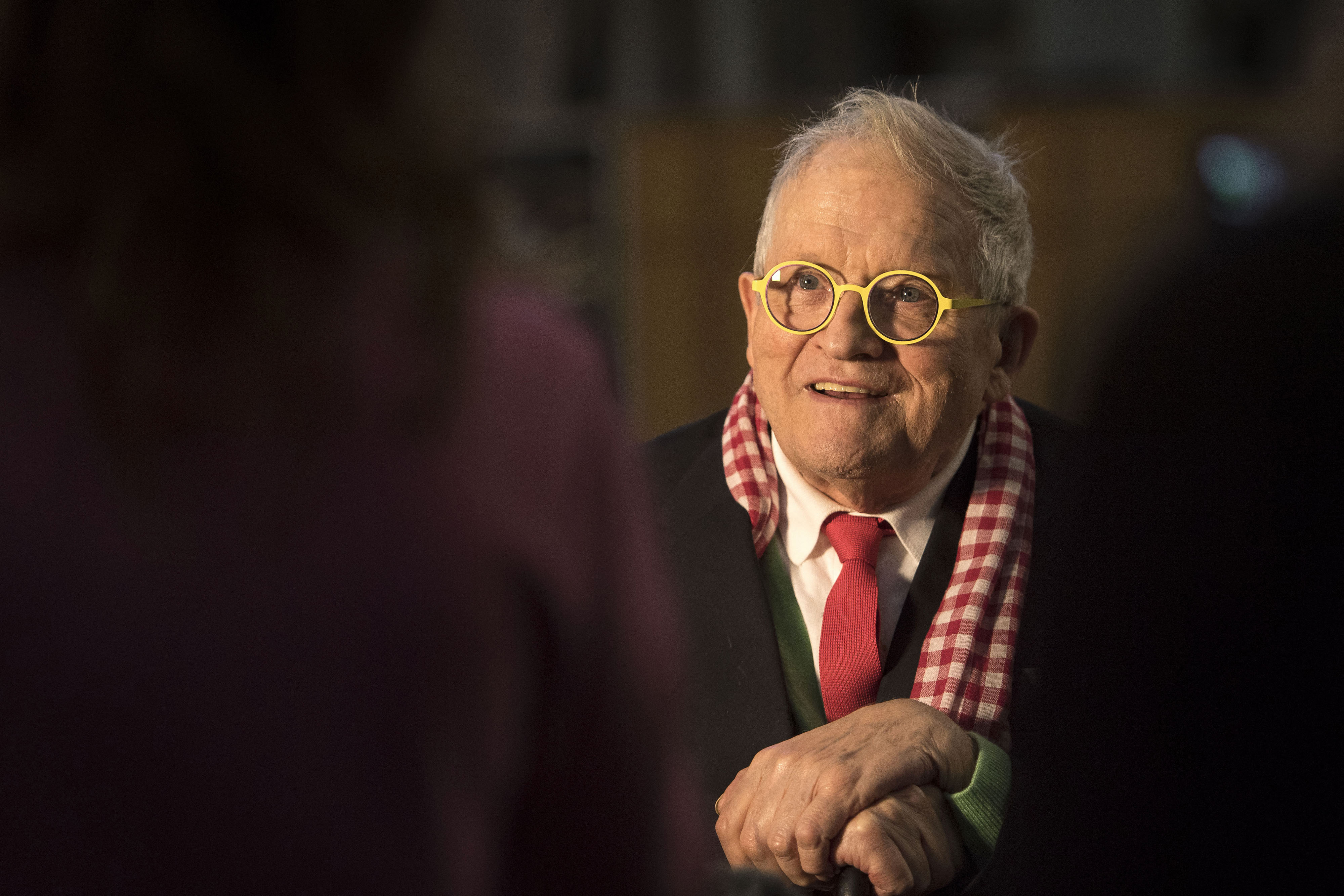 (FILES) British artist David Hockney gestures during a preview of The Queen's Window, a new stained glass window designed by Hockney and created by Barley Studio York, at Westminster Abbey in central London on September 26, 2018.