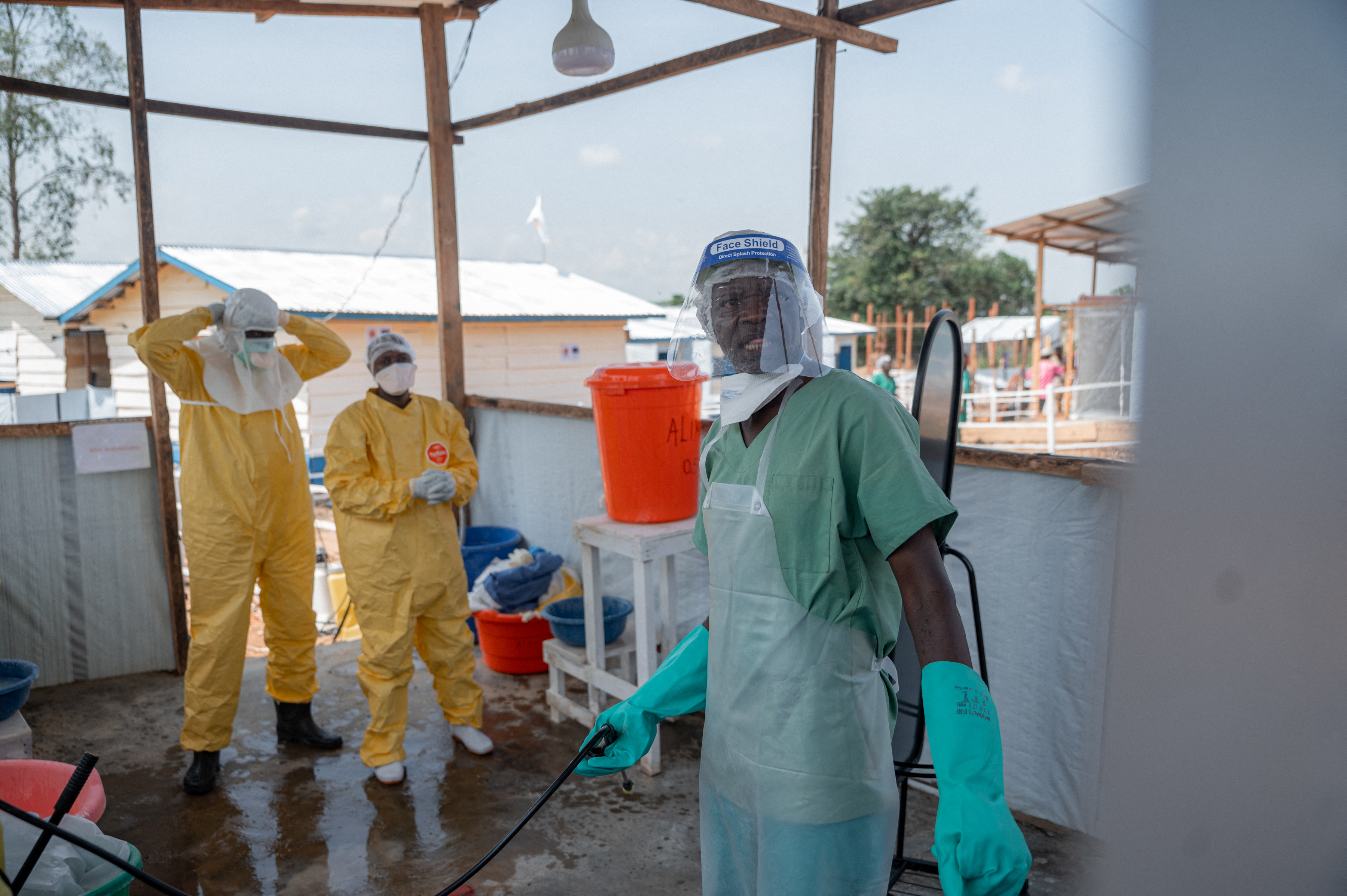 Healthcare workers are seen undergoing doffing procedures at the Ebola treatment centre of Rwampara General Reference Hospital in Rwampara, Ituri Province, Democratic Republic of Congo, on June 12, 2026.
