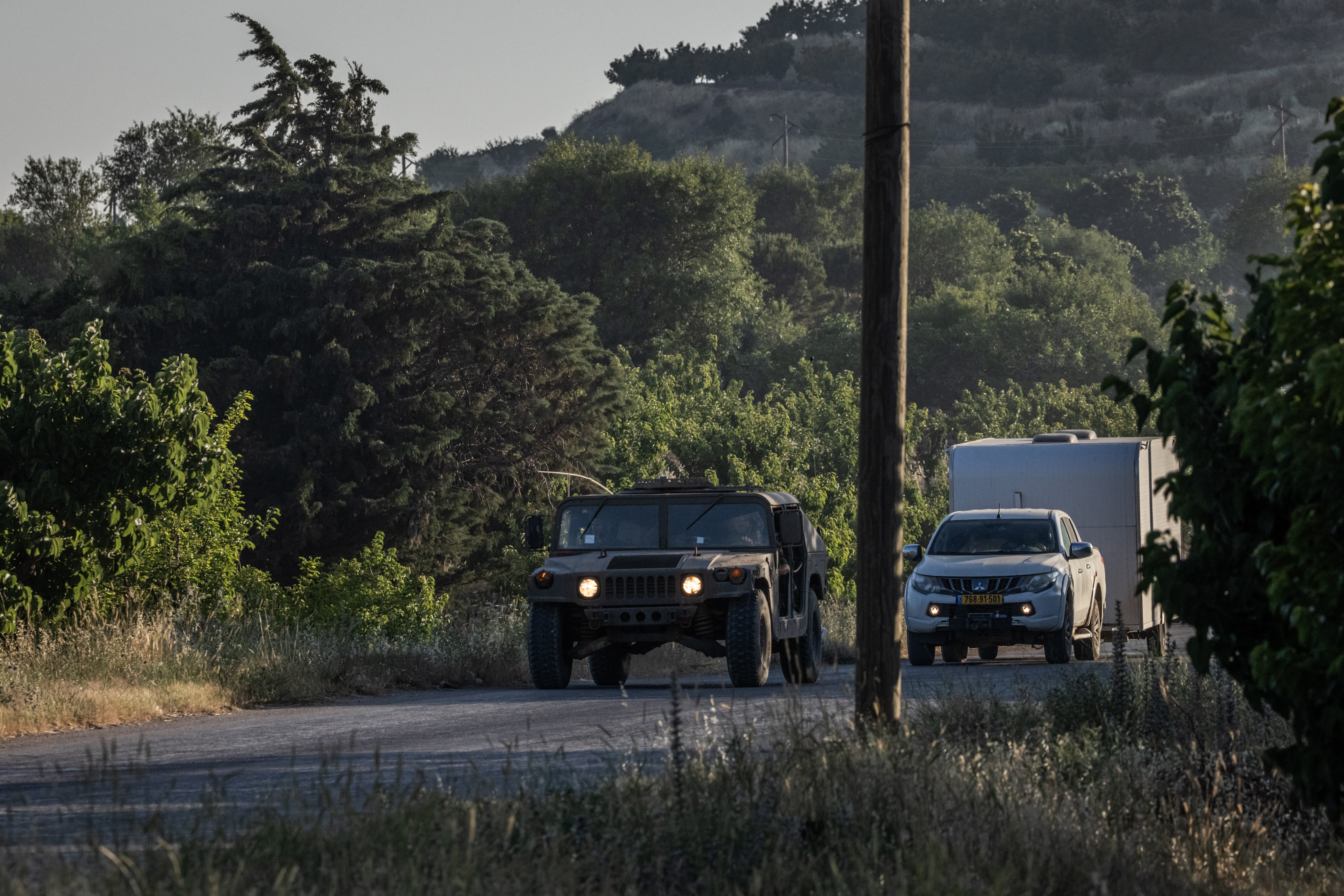 QUNEITRA, SYRIA - JUNE 11: Israeli military vehicles drive through the outskirts of the town of Hader towards an Israeli military base on Syrian territory on June 11, 2025 in Quneitra Governorate, Syria. Israeli forces have conducted routine operations in Syria since the fall of the Assad regime, patrolling areas in the southwest and launching airstrikes on Syria's military infrastructure. According to news reports today, Israeli Prime Minister Benjamin Netanyahu is interested in US-brokered negotiations with the new Syrian government. (Photo by Ed Ram/Getty Images)