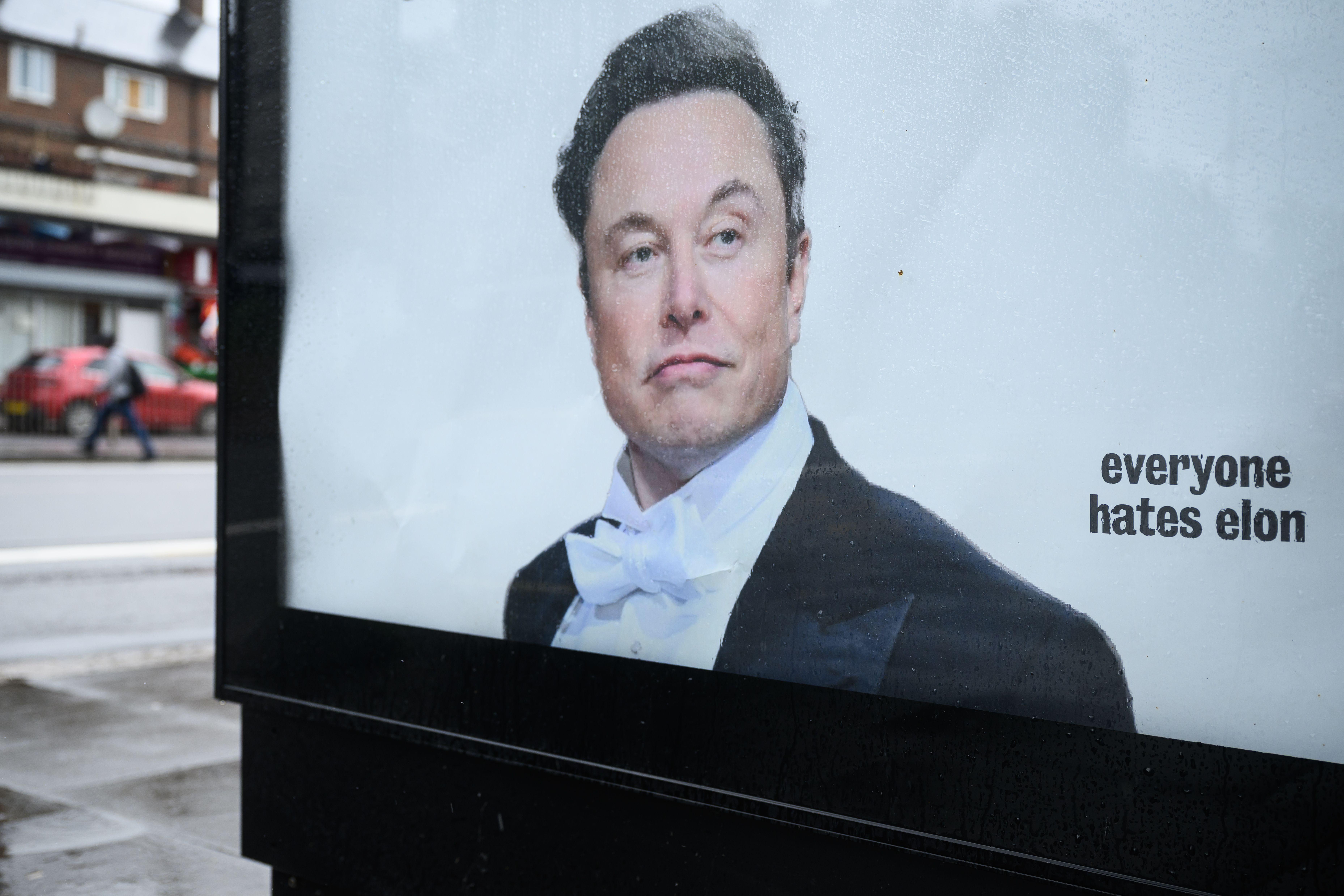 TOTTENHAM, ENGLAND - JUNE 11: An unofficially-installed poster critical of Elon Musk's wealth is displayed on a bus shelter on June 11, 2026 in Tottenham, England. The 'Everyone Hates Elon' activist group have placed posters in North London ahead of the SpaceX IPO on Friday, where Elon Musk looks set to become the world's first trillionaire. (Photo by Leon Neal/Getty Images)
