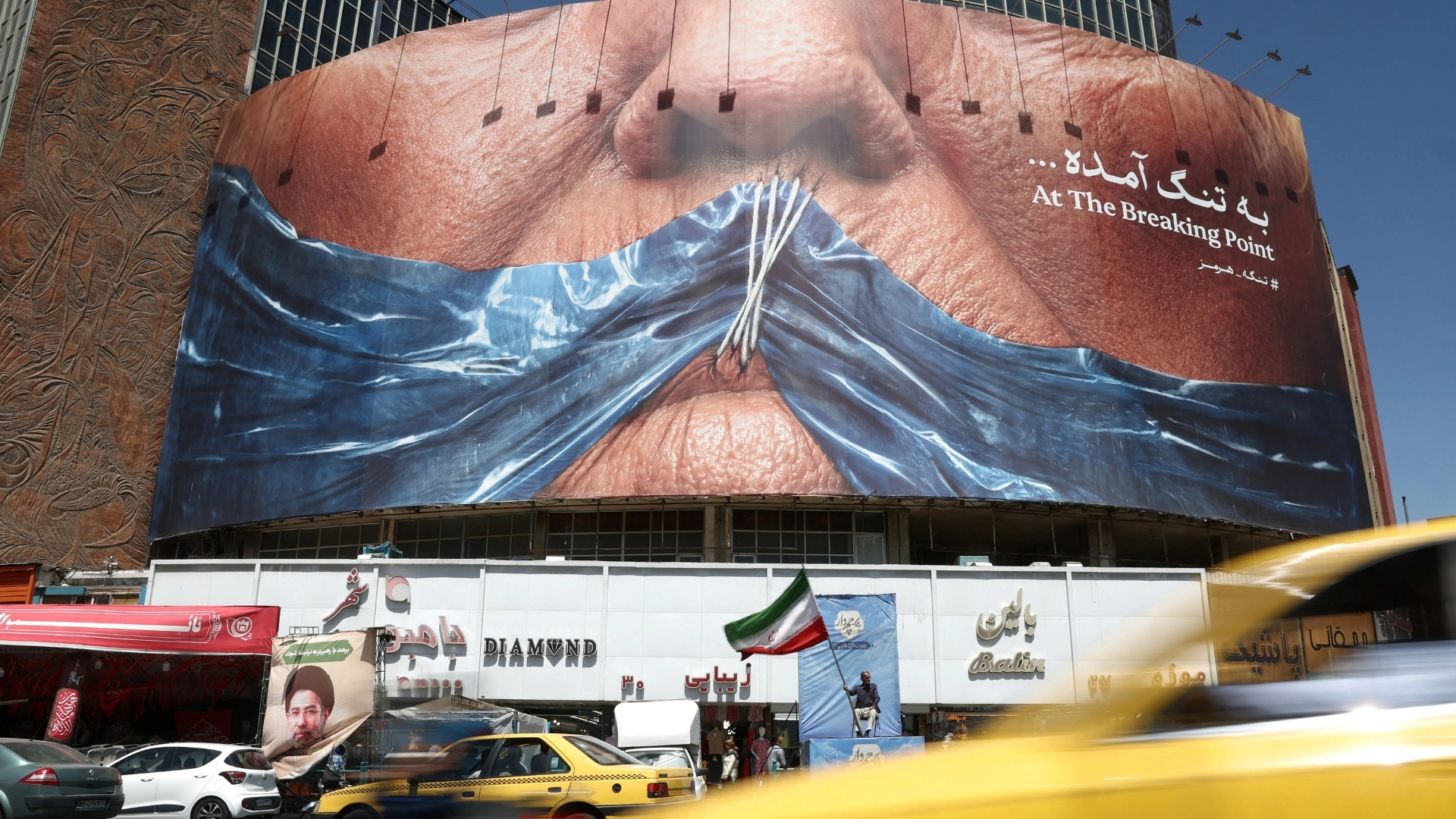 Banners depicting the late leader of the Islamic Revolution, Ayatollah Ruhollah Khomeini, and the late Iran's Supreme Leader Ayatollah Ali Khamenei, during Friday prayer in Tehran, Iran, on June 12, 2026. [Majid Asgaripour/West Asia News Agency via Reuters]
