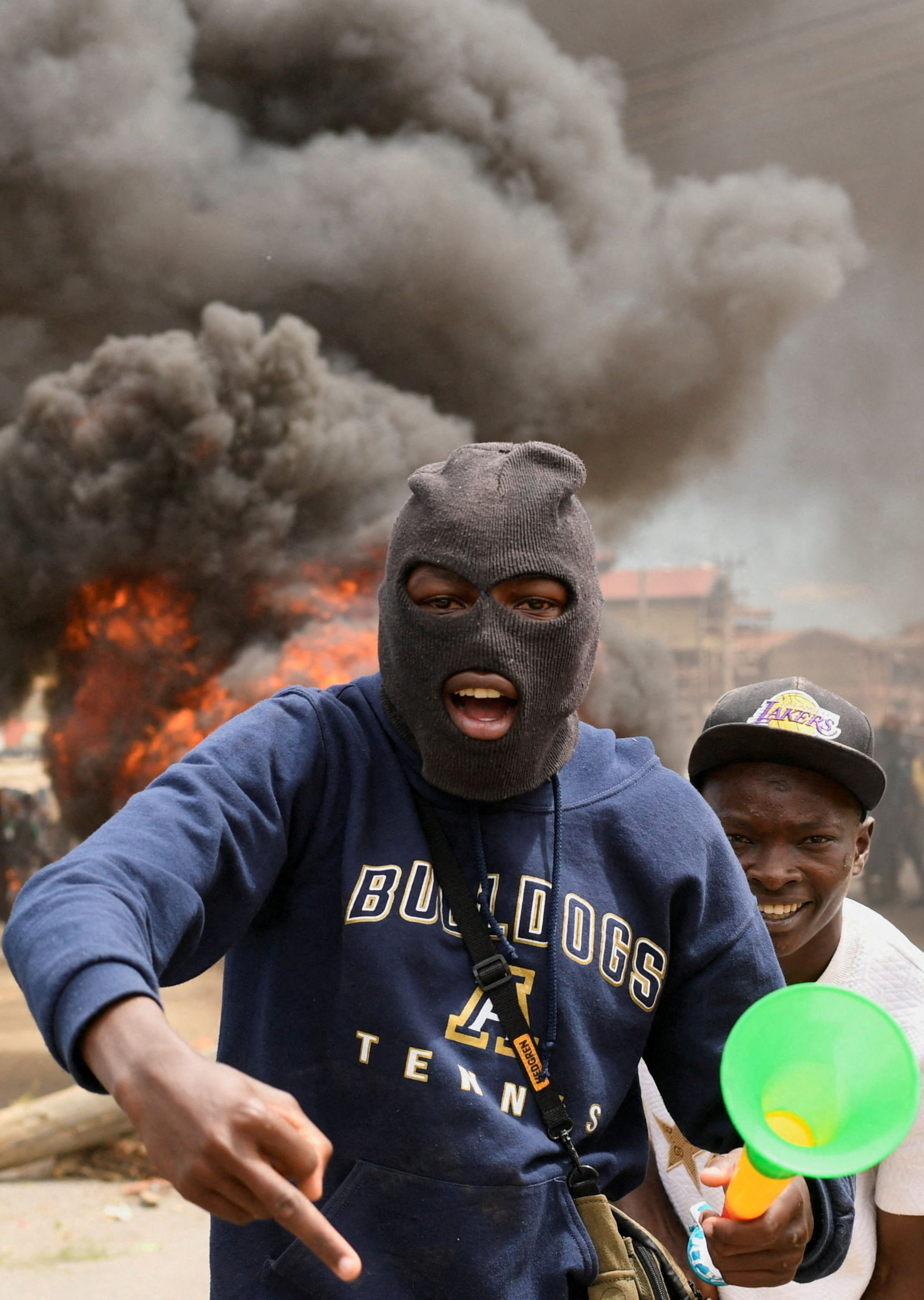 Demonstrators gather near a barricade they created during a protest against a U.S.-backed Ebola quarantine plan on the establishment of a 50-bed facility at a Kenyan air force base that was intended to host Americans exposed to Ebola, in Nanyuki town, in Laikipia County, Kenya June 1, 2026. REUTERS/John Muchucha