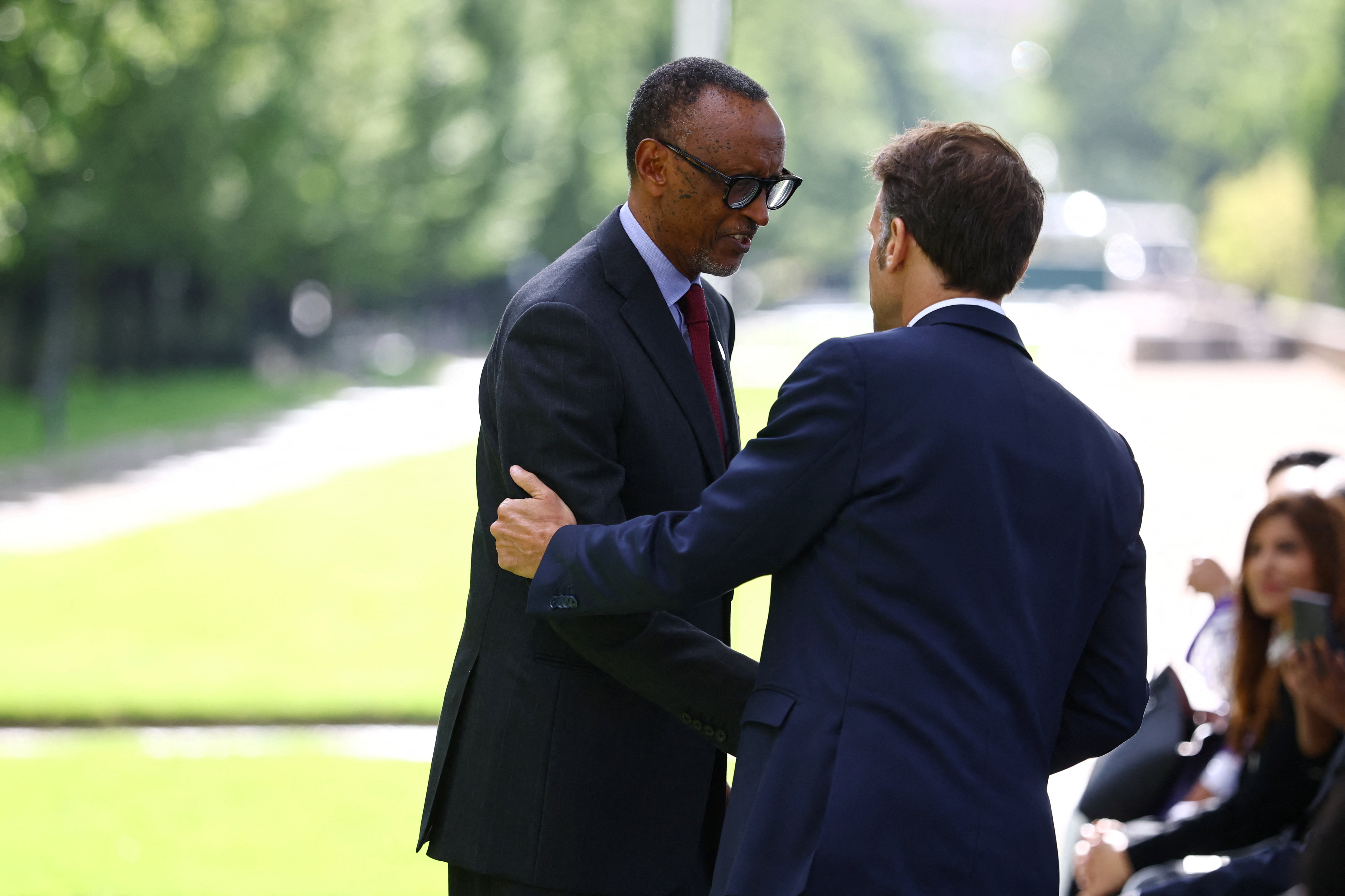 French President Emmanuel Macron shakes hands with Rwandan President Paul Kagame during the inauguration ceremony of a new memorial site paying tribute to the victims of the Rwanda's genocide at the Habib-Bourgiba esplanade along the River Seine, in Paris, France, June 2, 2026. REUTERS/Sarah Meyssonnier/Pool