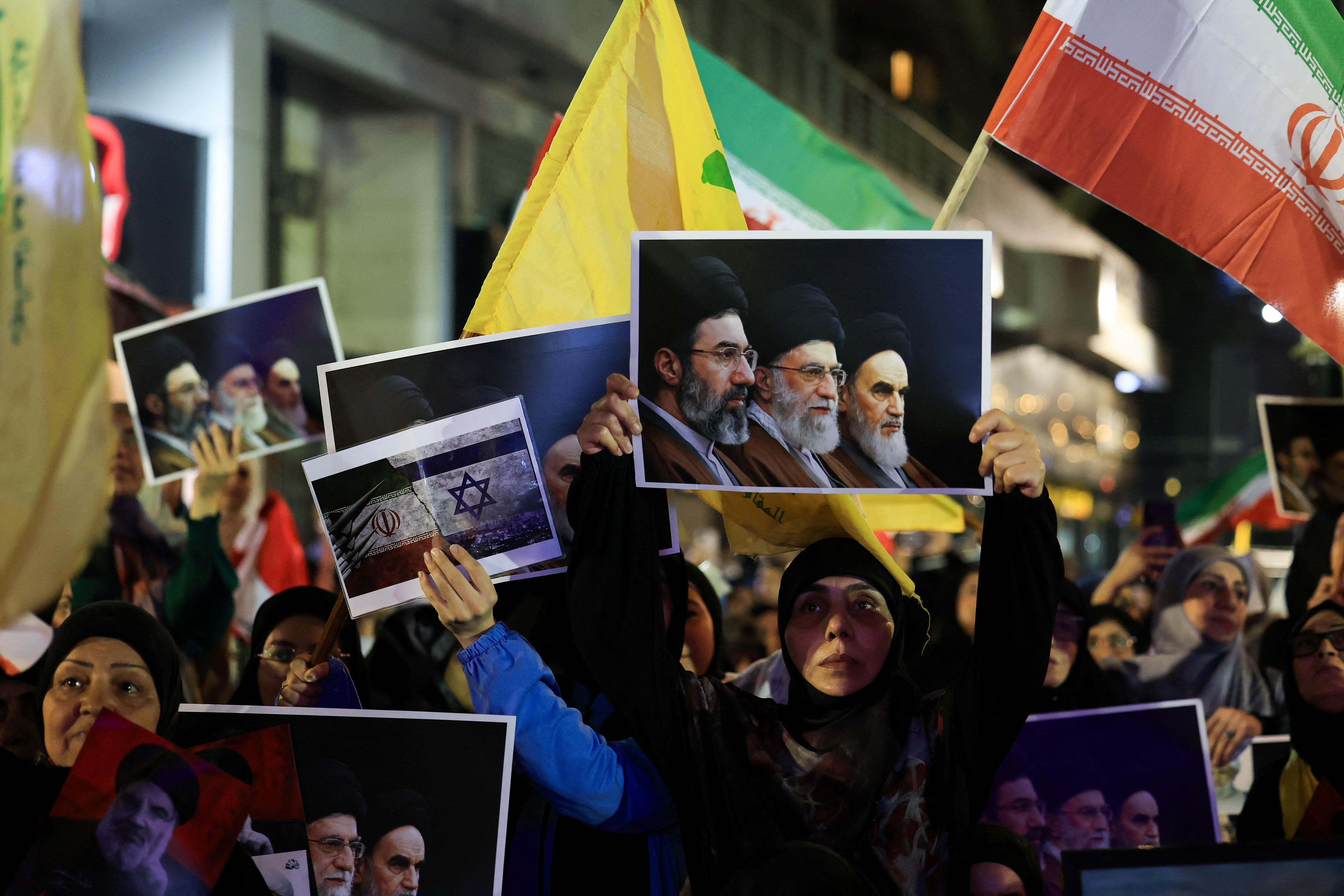 Hezbollah supporters hold flags and posters during a rally in Beirut's southern suburbs, Lebanon June 10, 2026. REUTERS/Mohamed Azakir
