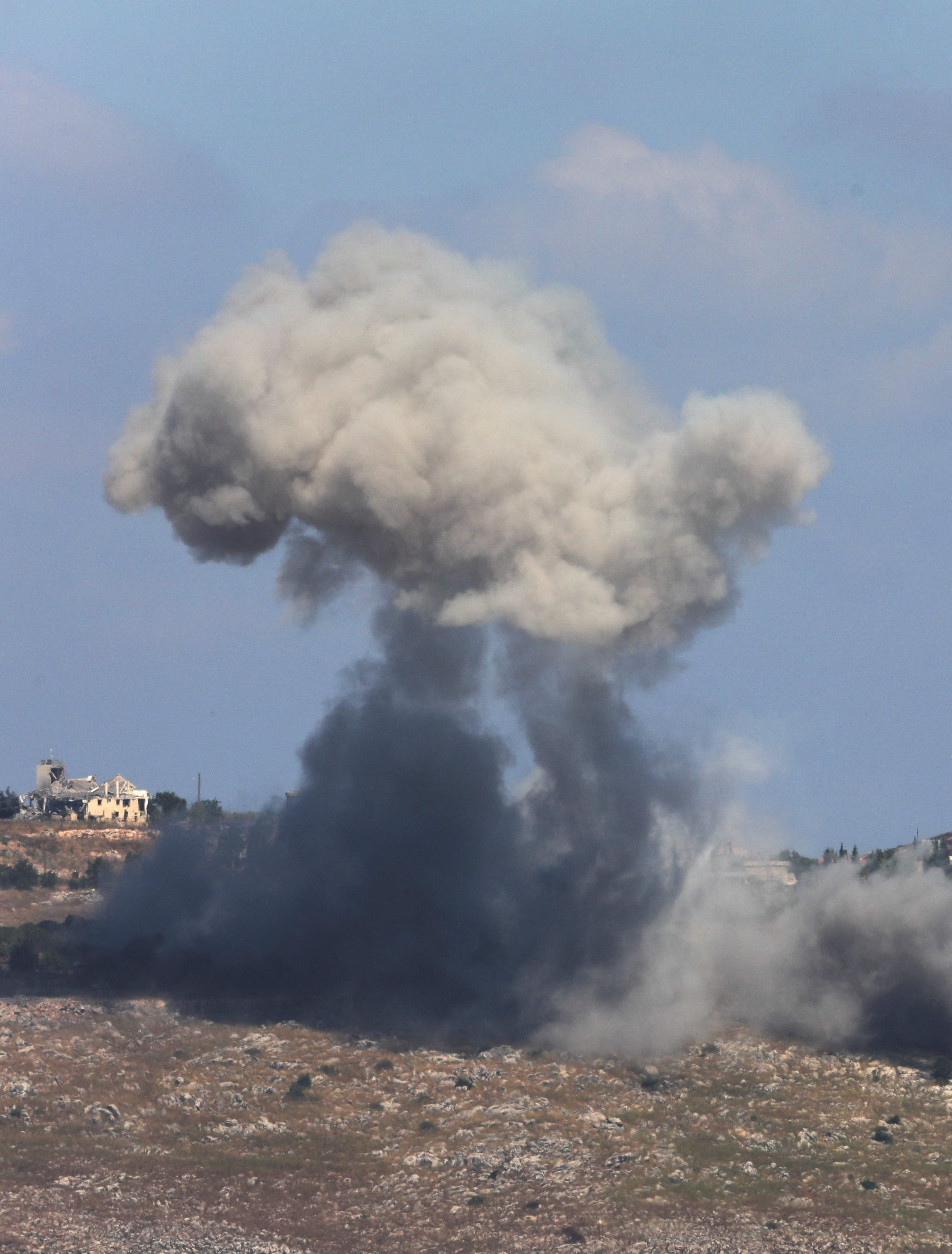 Smoke billows following an attack.