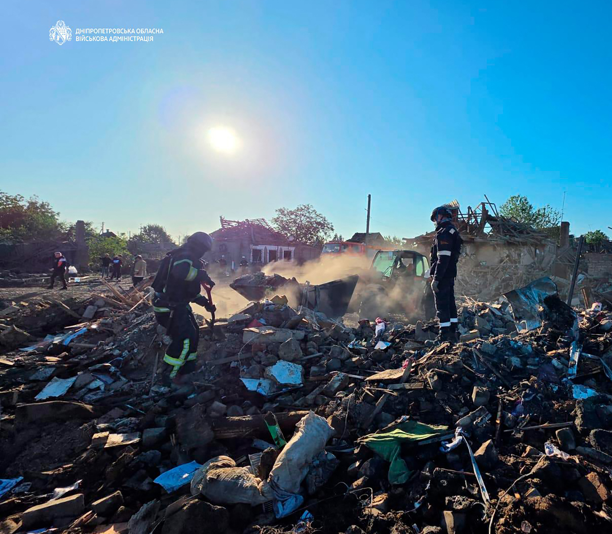 In this handout photograph taken and released by the Dnipropetrovsk Regional Military Administration on July 30, 2026, Ukrainian rescuers work among rubble of a destroyed house following an air attack in Radushne, Kryvyi Rig region, amid the Russian invasion of Ukraine.