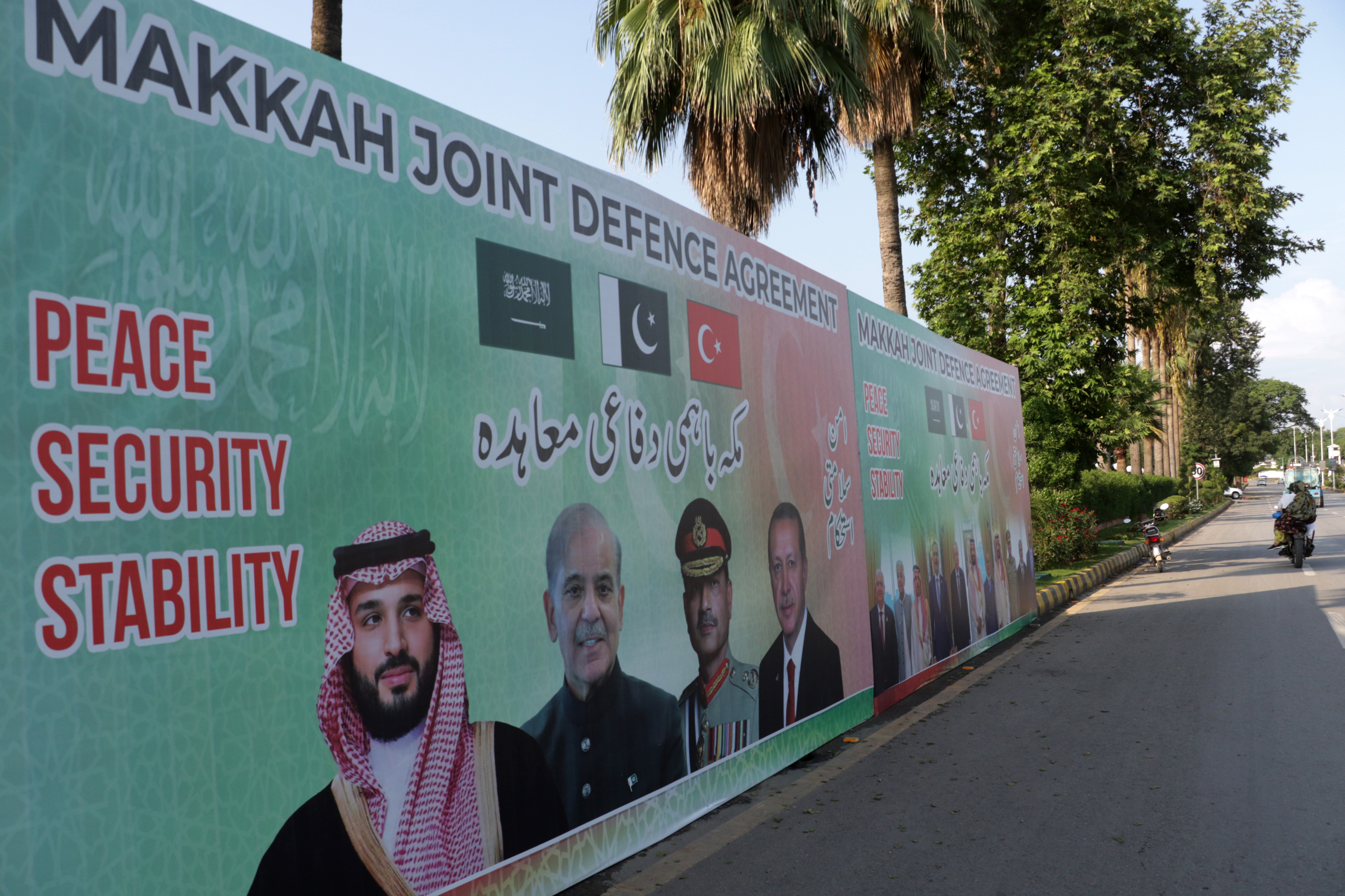 epa13157130 Billboards featuring Crown Prince and Prime Minister of the Kingdom of Saudi Arabia, Mohammed bin Salman; Pakistan's Prime Minister, Muhammad Shehbaz Sharif; Turkish President, Recep Tayyip Erdogan; and Pakistan's Chief of Army Staff, Field Marshal Asim Munir, are displayed on a road in Islamabad, Pakistan, 08 August 2026. Pakistan, Saudi Arabia, and Turkey signed a joint defense agreement during the Makkah Al-Mukarramah Summit for Joint Defense at Al-Safa Palace in Makkah, Saudi Arabia, on 07 August 2026. The pact stipulates that an armed attack against any one of the three countries will be regarded as an attack against all, strengthening collective deterrence and defense cooperation among the three states.  EPA/SOHAIL SHAHZAD