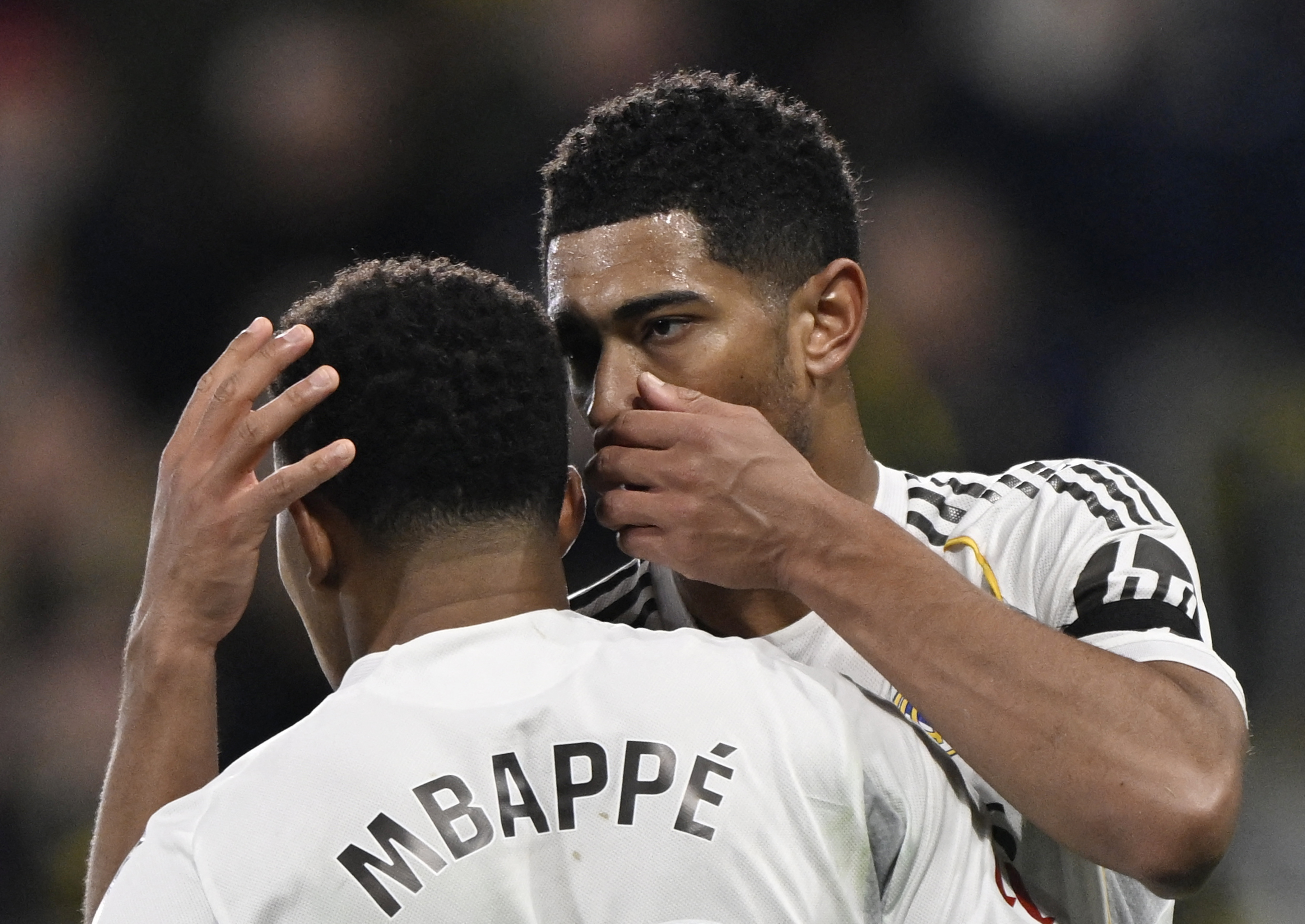Real Madrid's Kylian Mbappe talks with Jude Bellingham